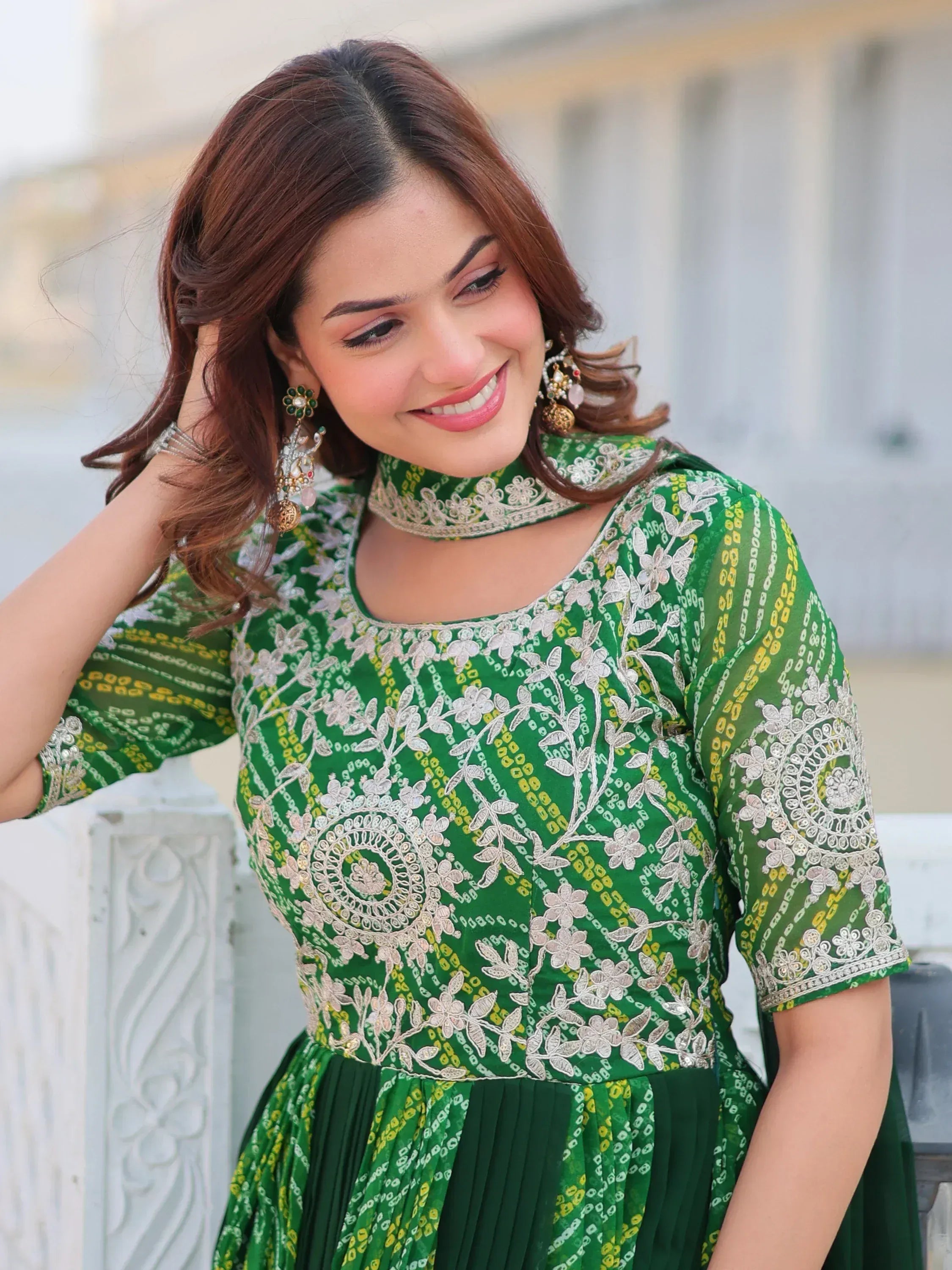 Green embroidered ethnic gown with floral patterns and choker neckline