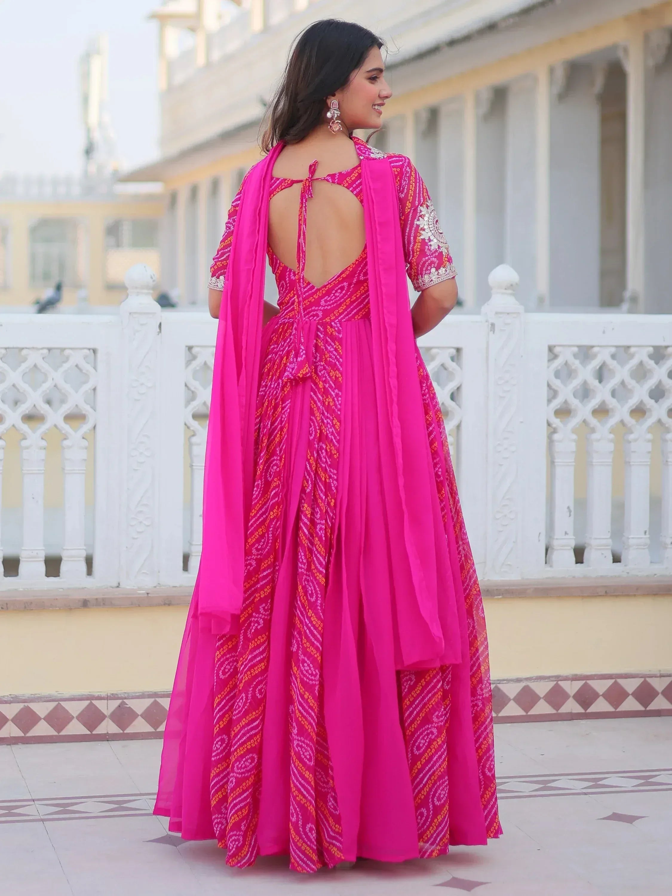 Pink printed ethnic gown with open back and dupatta, perfect for Indian occasions