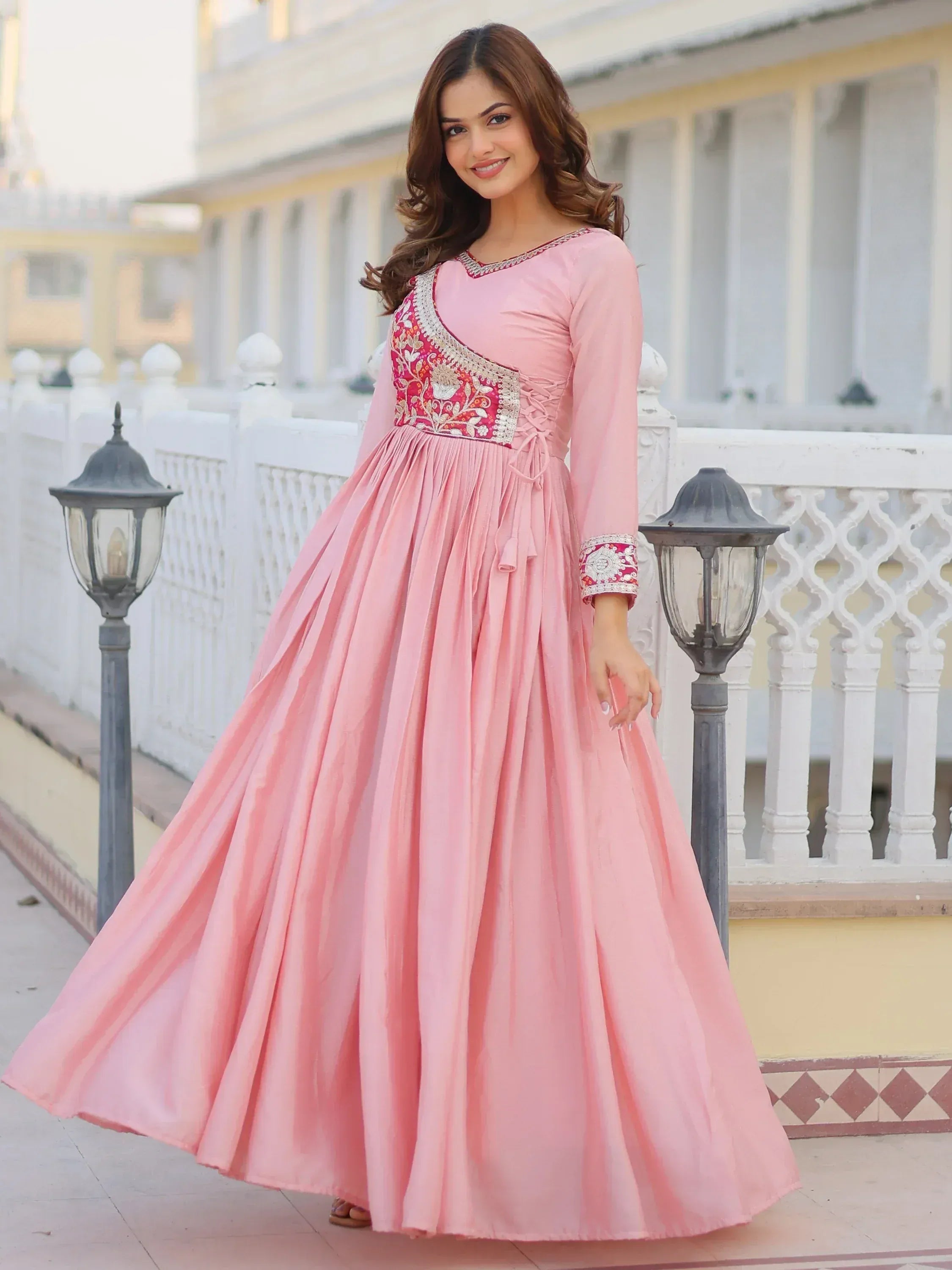 Pink ethnic gown with floral embroidery, perfect for Indian occasions and festive wear.