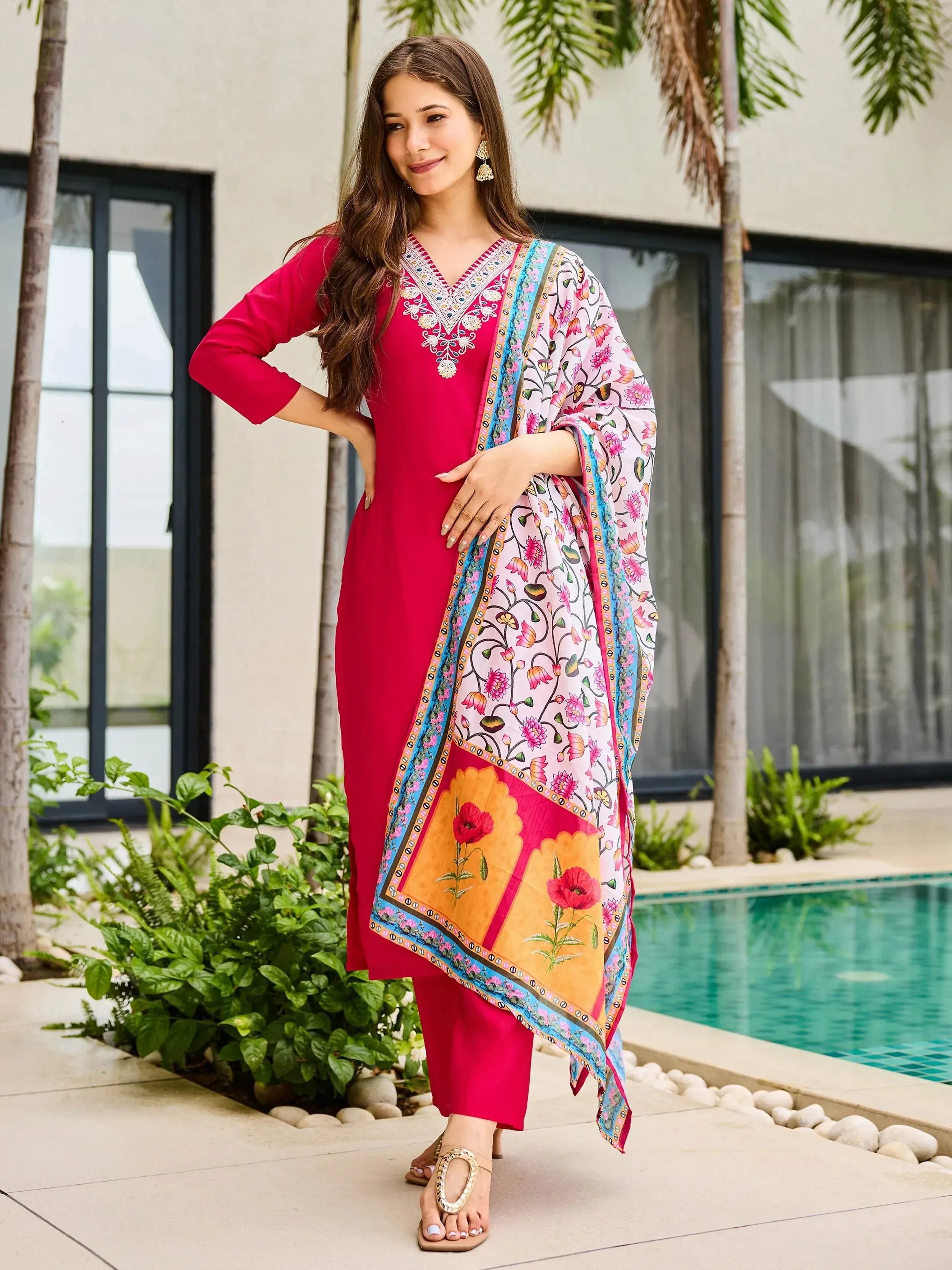 Woman in vibrant pink embroidered kurta with floral dupatta, stylish ethnic wear for women