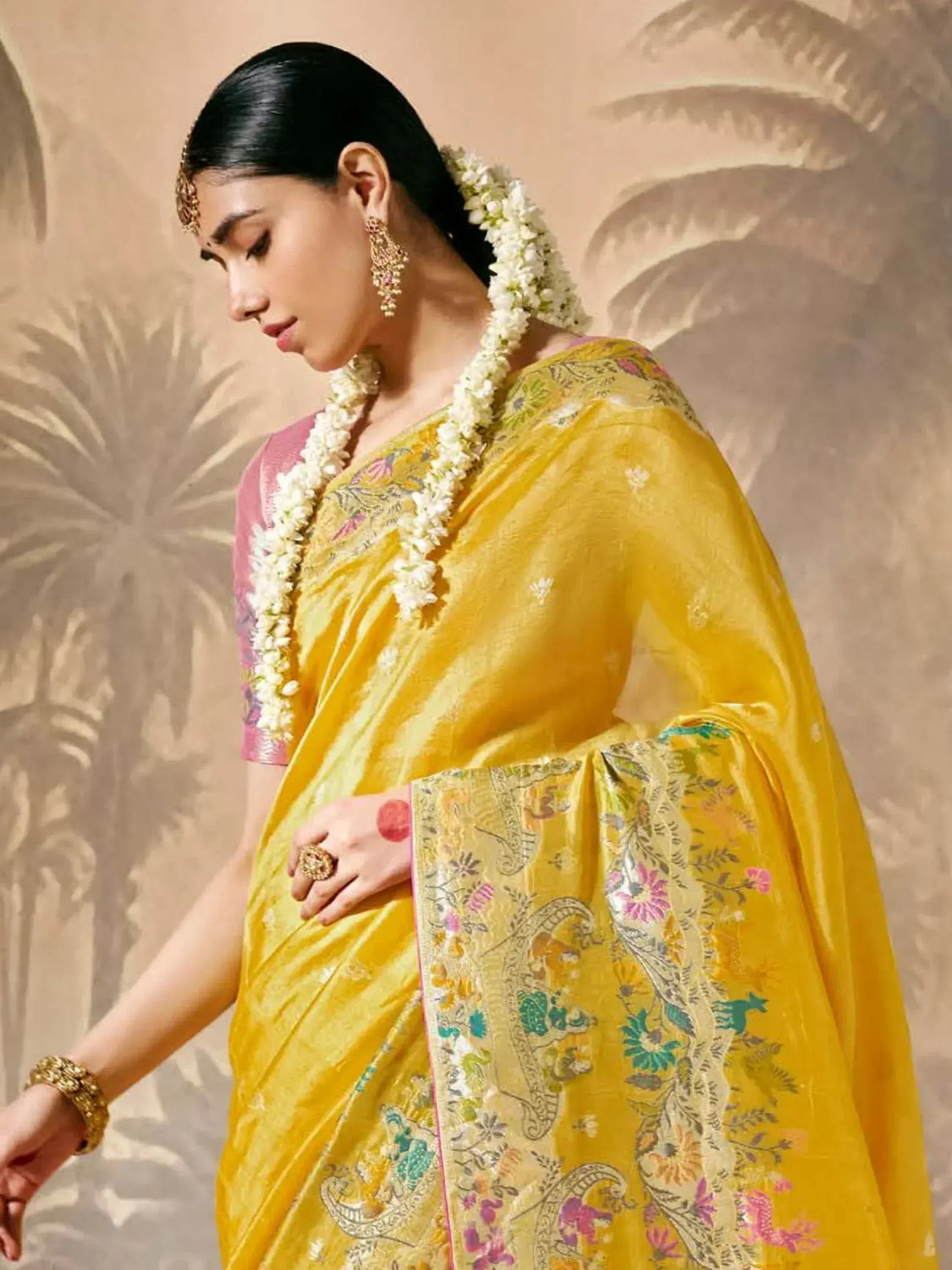 Yellow embroidered saree with floral border, traditional Indian ethnic wear for women