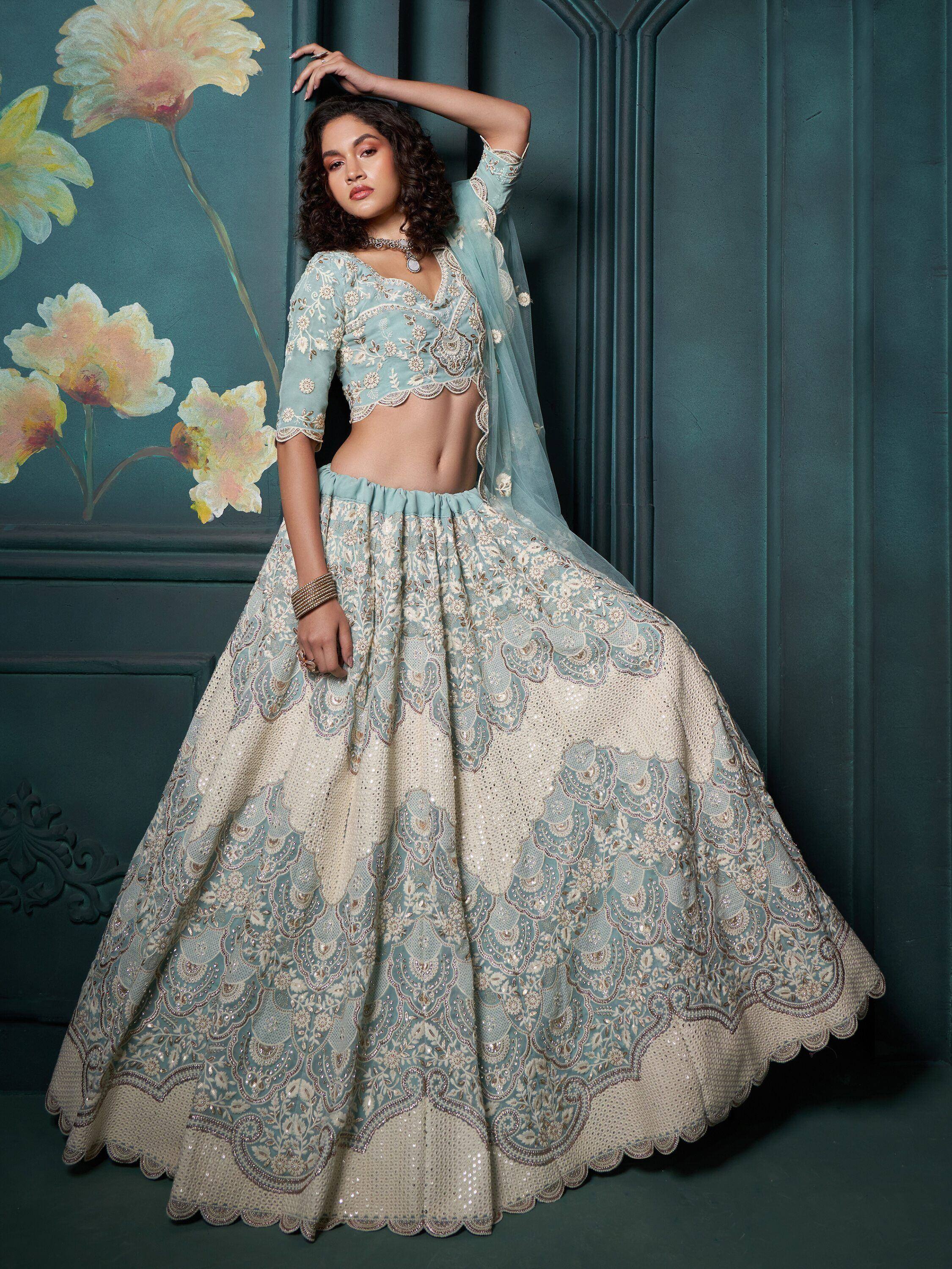 Elegant light blue embroidered lehenga choli with floral motifs, perfect for Indian ethnic occasions.