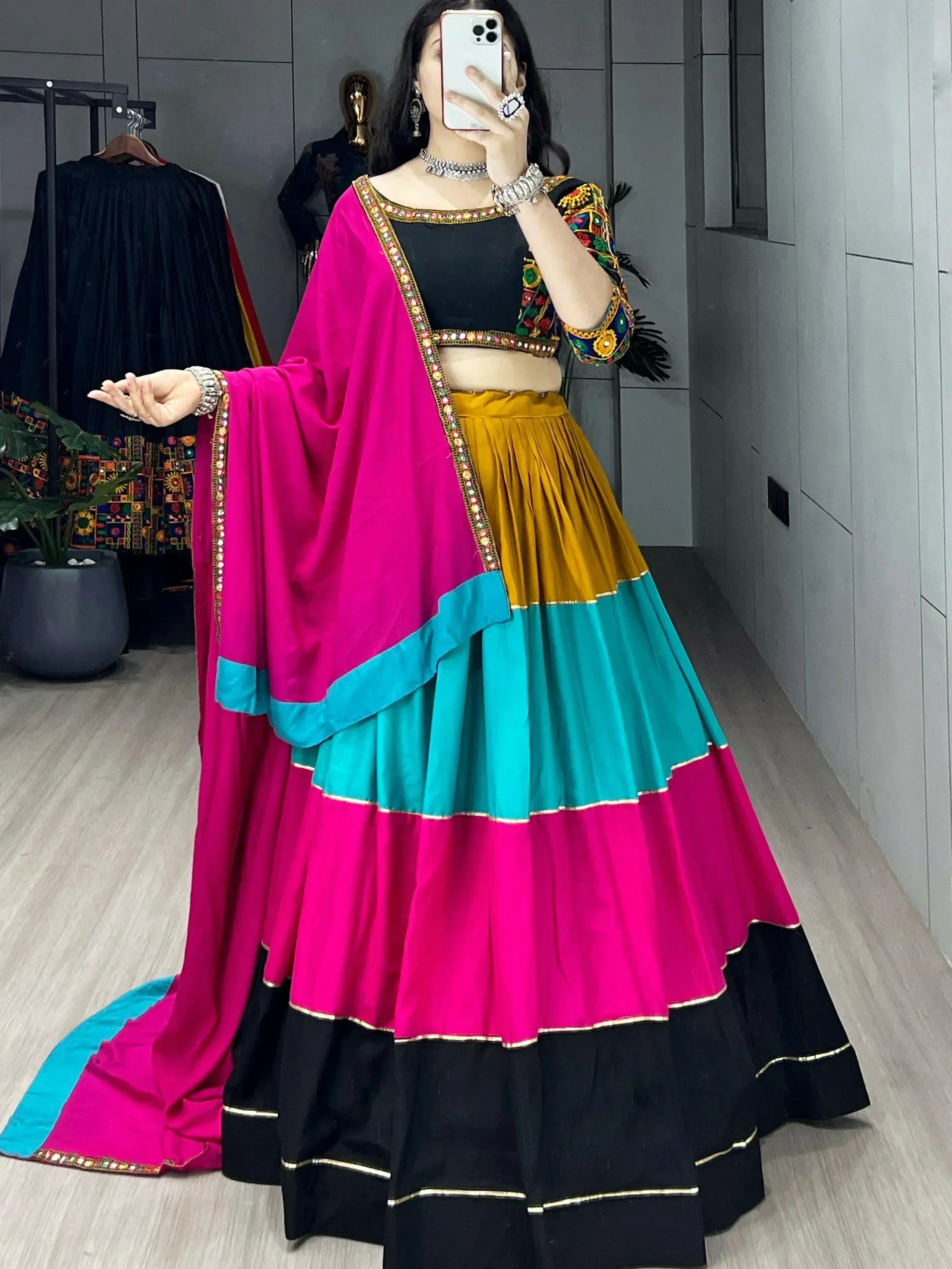 Colorful Indian lehenga choli with embroidered blouse, layered skirt, and dupatta for ethnic wear