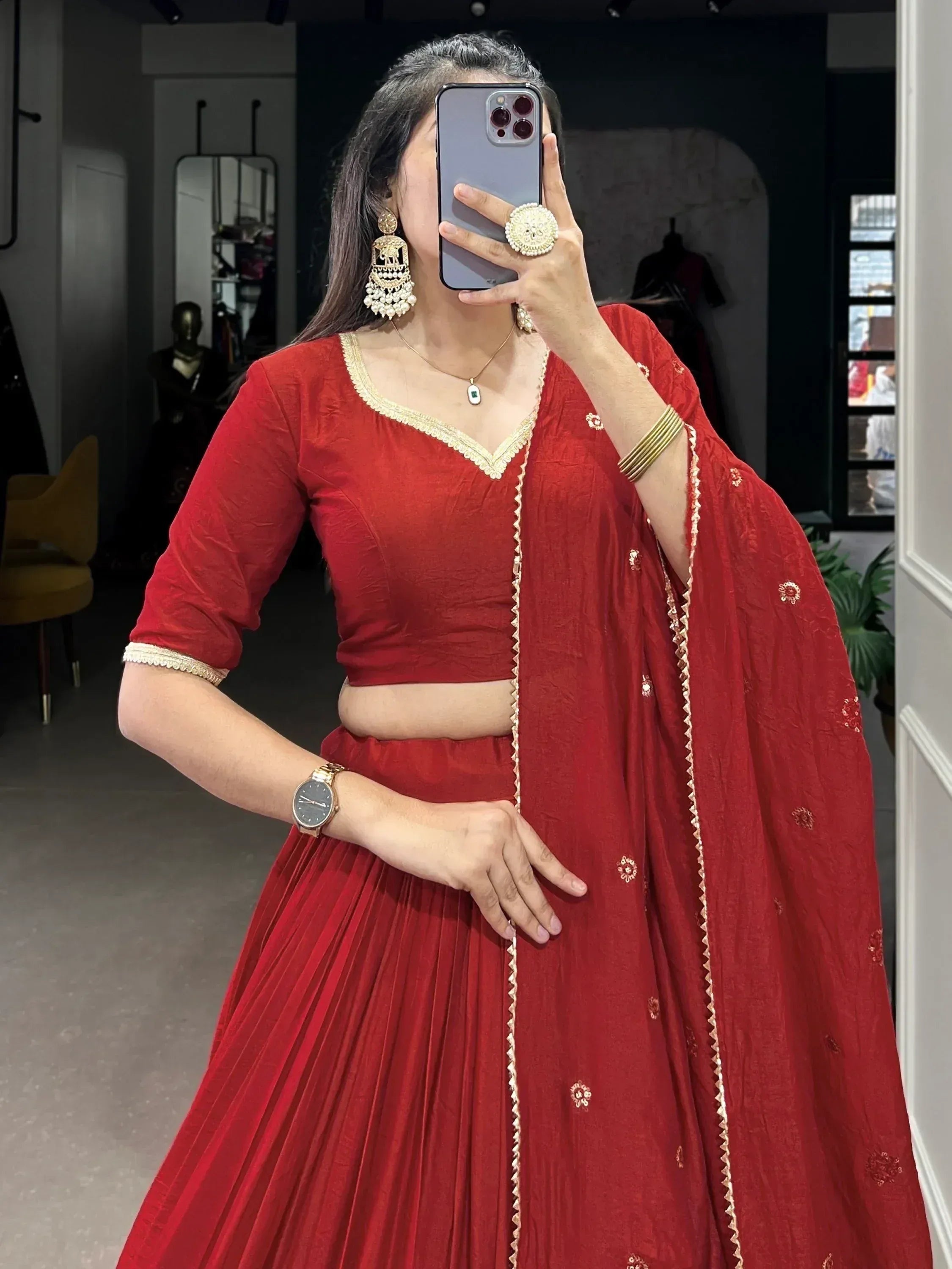 Red ethnic lehenga choli with gold embroidery, perfect for weddings and festivals