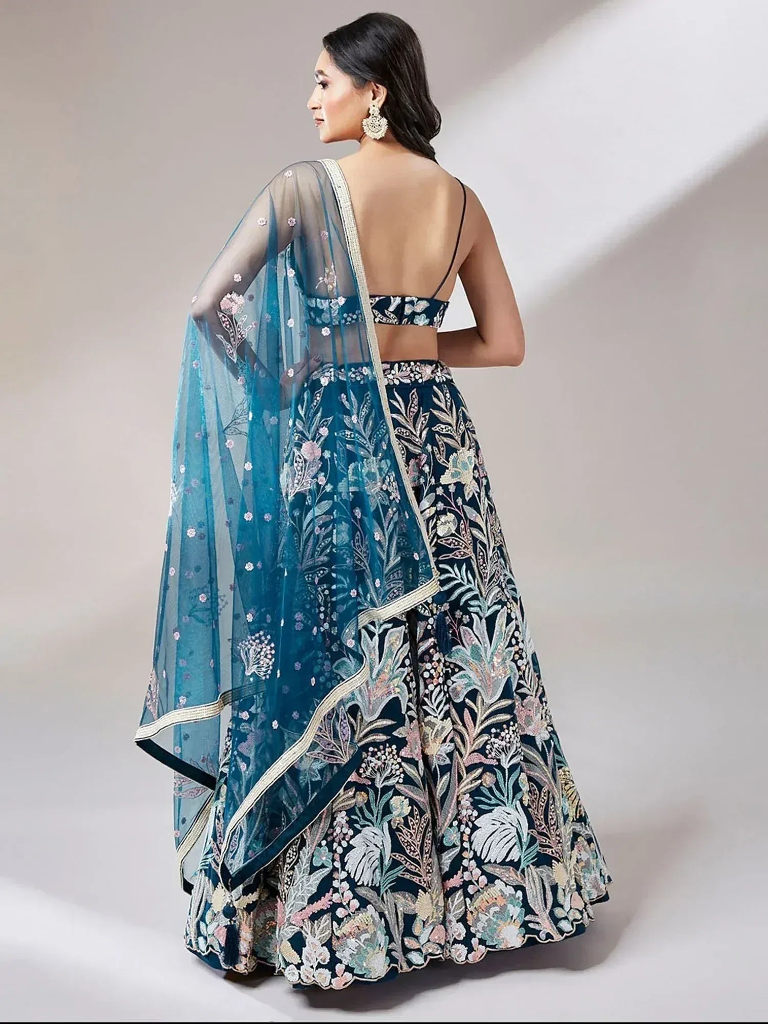 Blue floral embroidered lehenga choli with sheer dupatta, back view