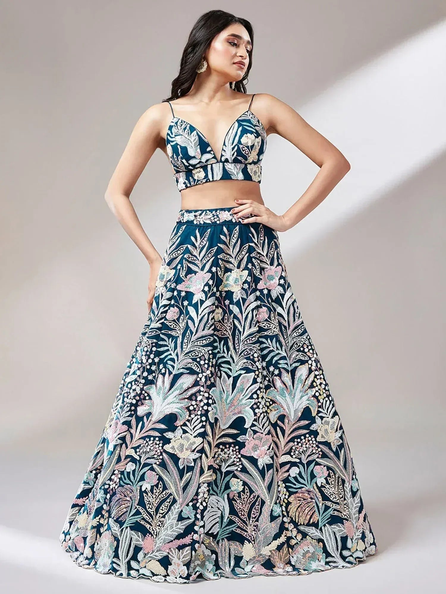 Elegant navy blue lehenga choli with floral embroidery, perfect for Indian ethnic wear occasions.