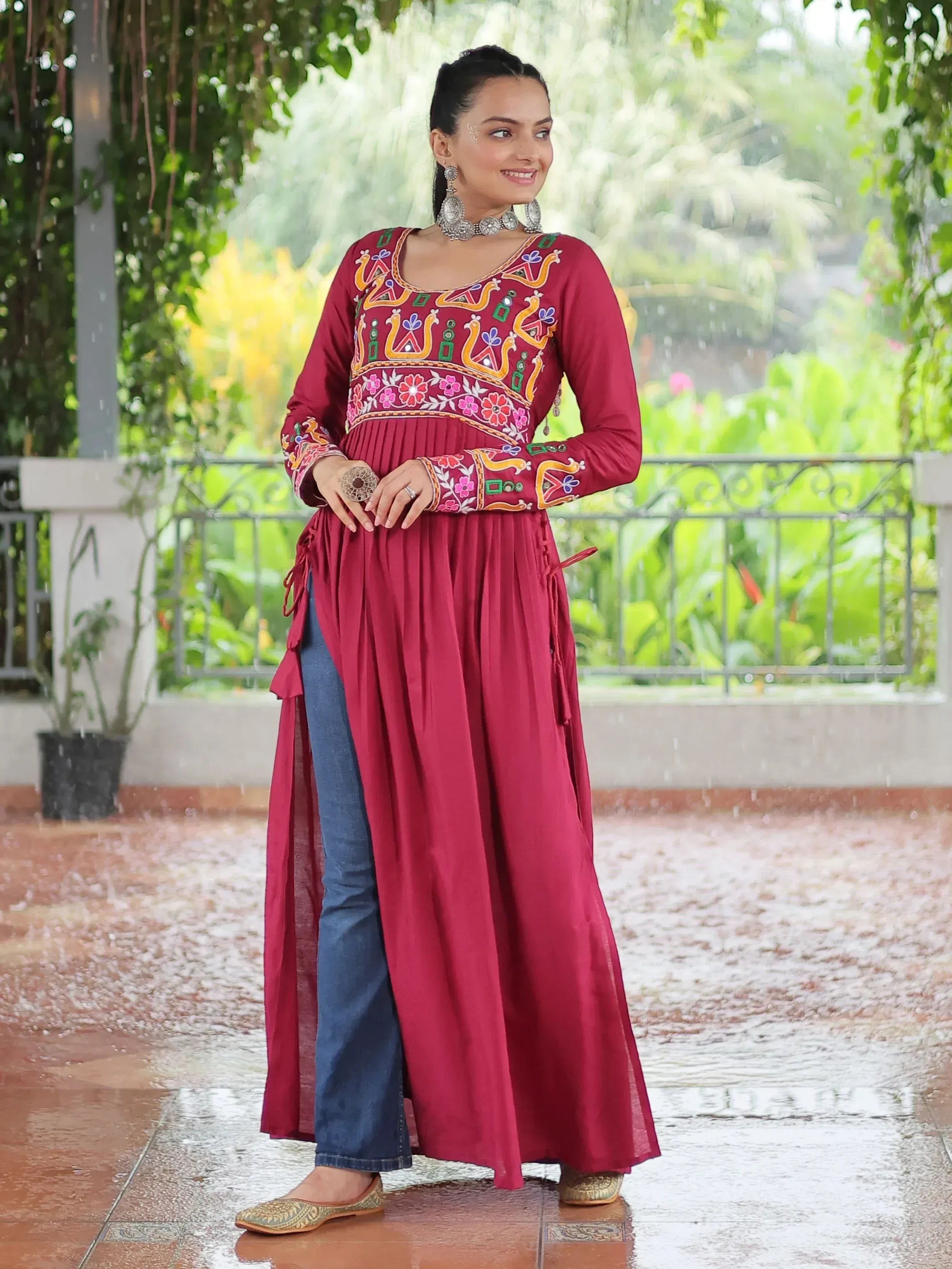 Maroon embroidered ethnic kurti with denim pants, perfect for Indian festive wear