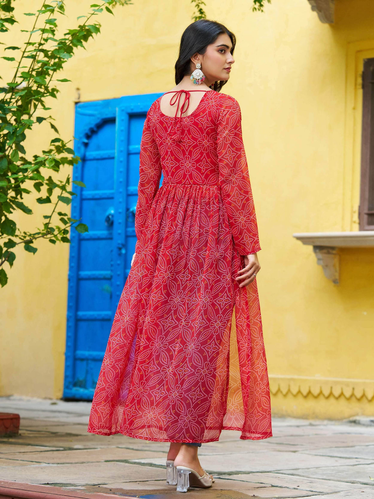 Red printed ethnic gown with tie-back detail, perfect for festive occasions and traditional events.