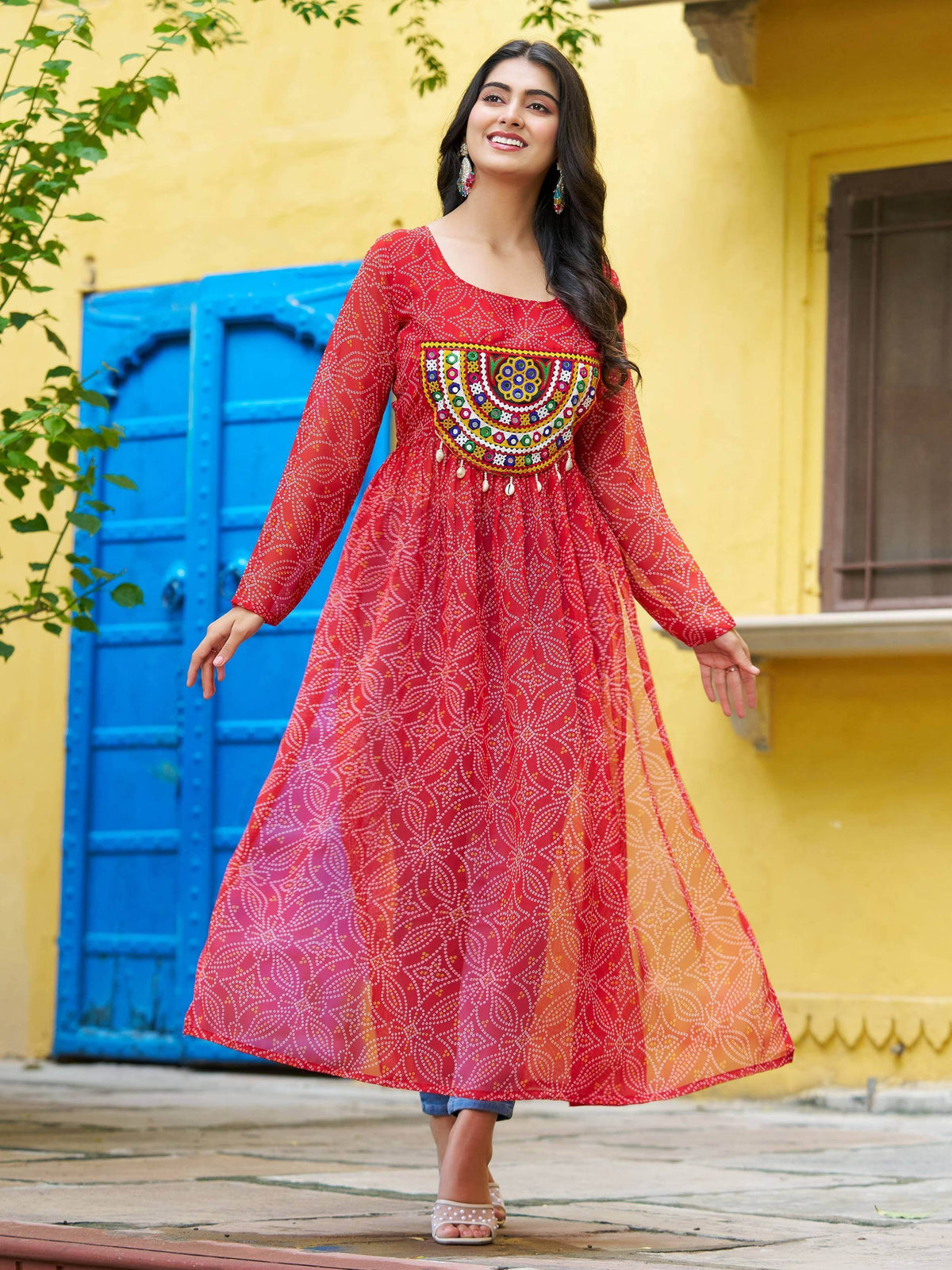 Red ethnic anarkali with mirror work, perfect for festive occasions and traditional celebrations.