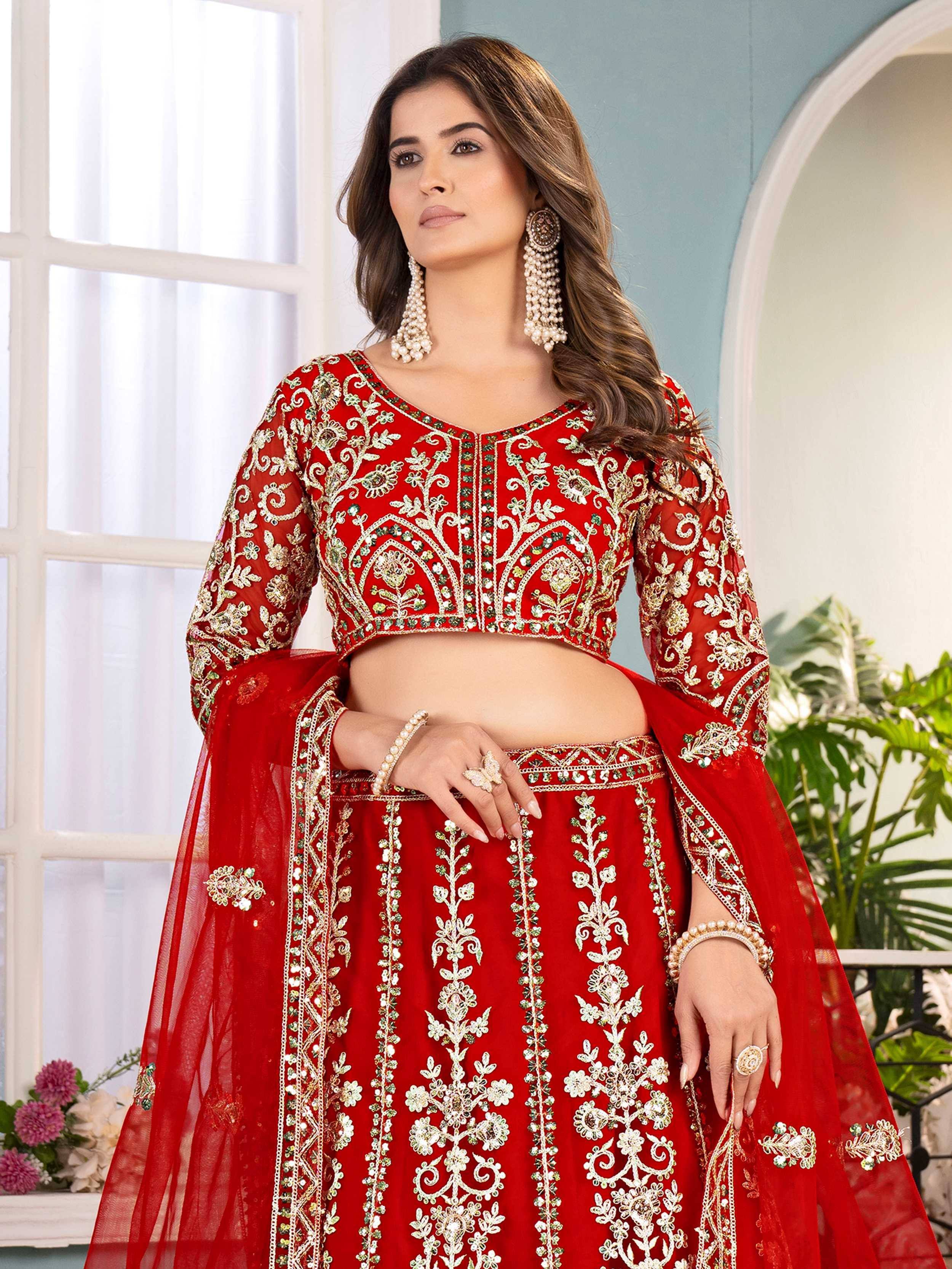 Red embroidered lehenga choli with gold floral work, perfect for Indian weddings and festive occasions