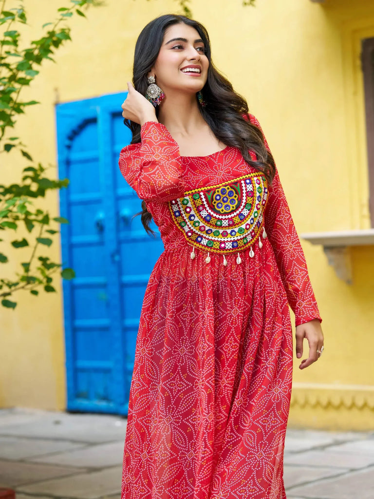 Red ethnic gown with mirror work and bandhani print, perfect for Indian festivals and occasions