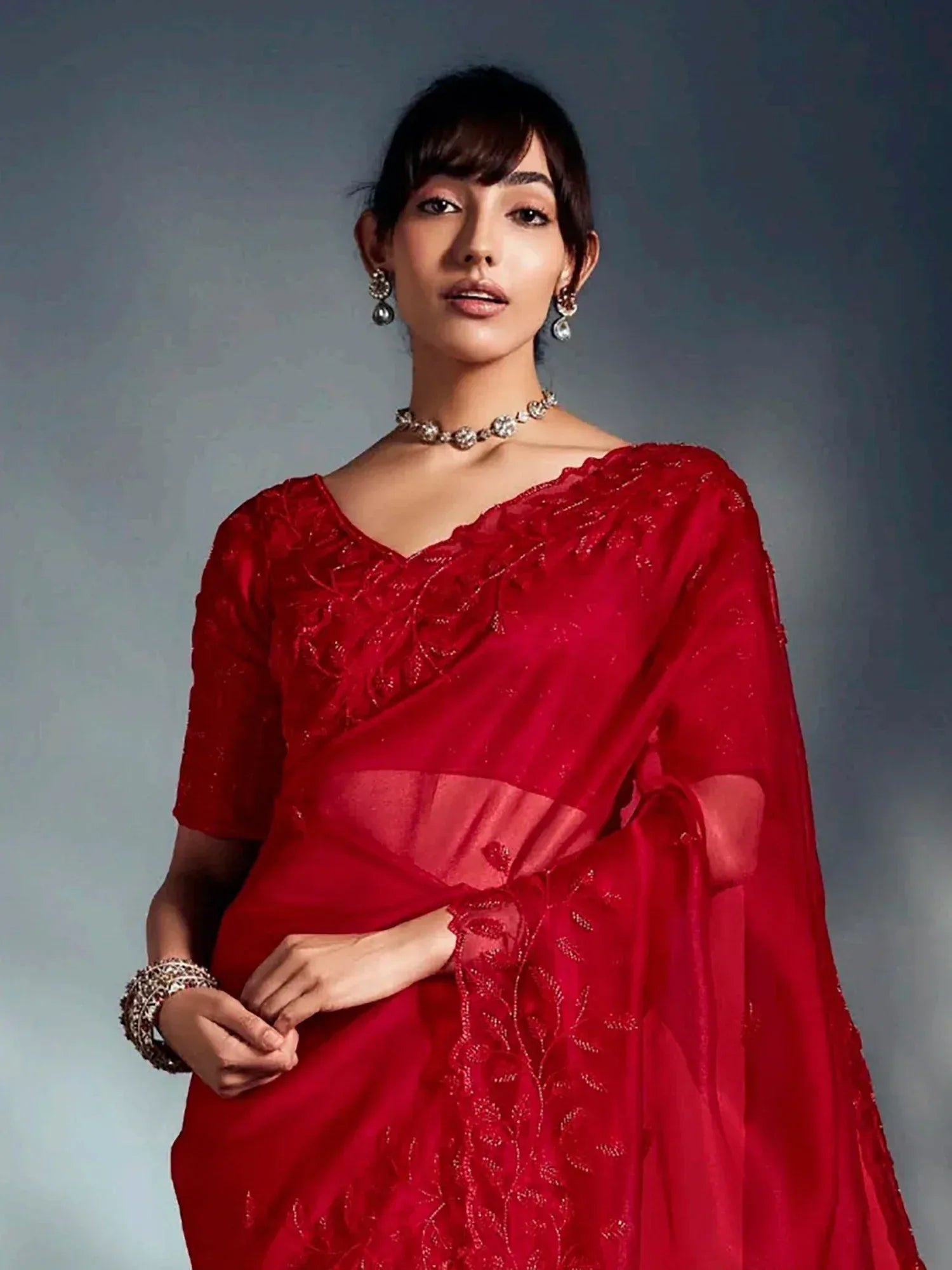 Red embroidered saree with designer blouse, perfect for Indian ethnic wear occasions