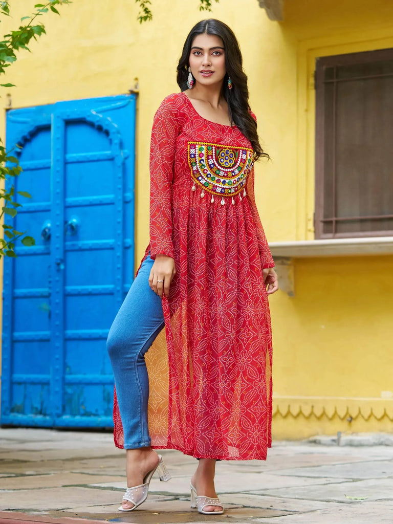 Red printed kurta with colorful embroidery, paired with jeans, perfect for ethnic wear