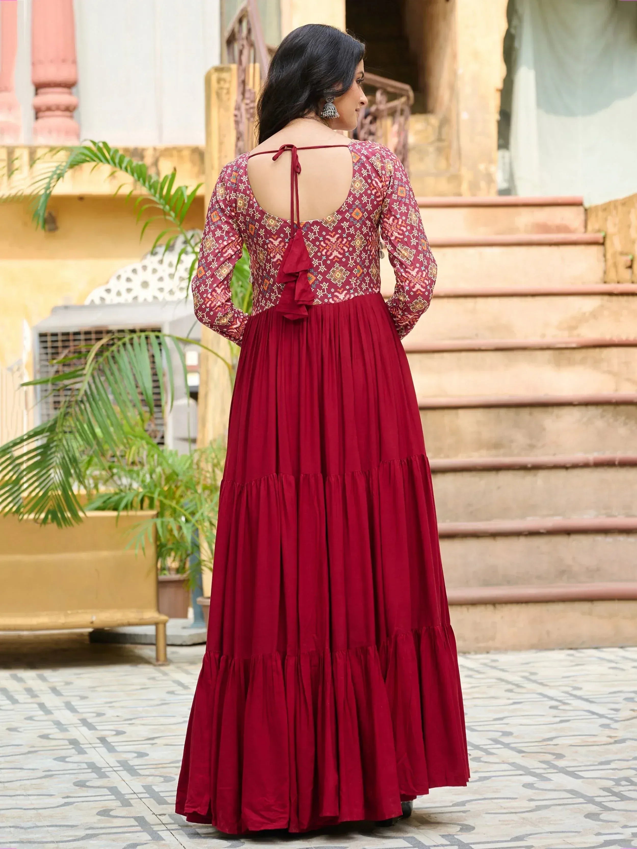 Maroon ethnic gown with printed bodice, tie-back, and tiered skirt for women
