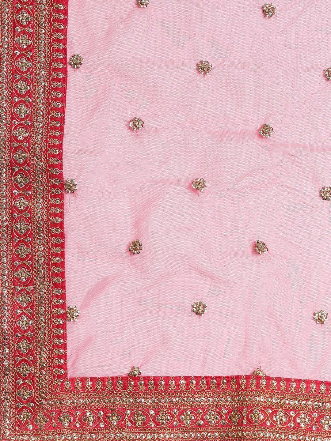 Pink ethnic saree with red embroidered border and floral embellishments