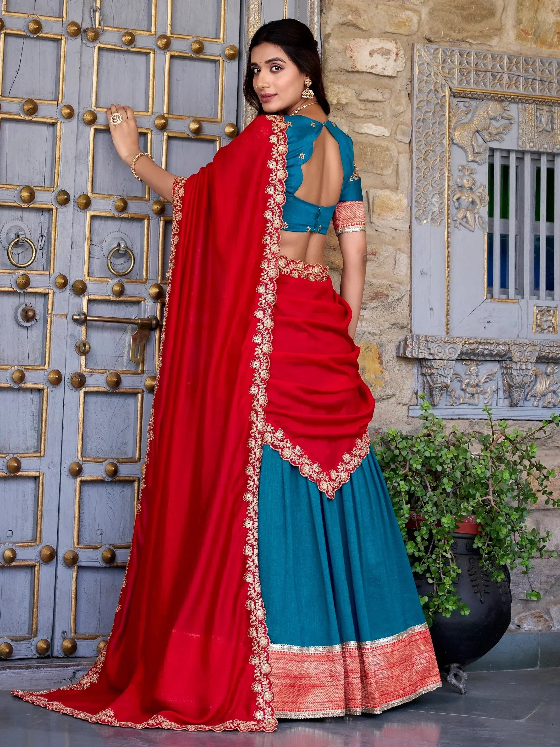 Red and teal designer lehenga choli with gold embroidery, perfect for Indian ethnic wear occasions