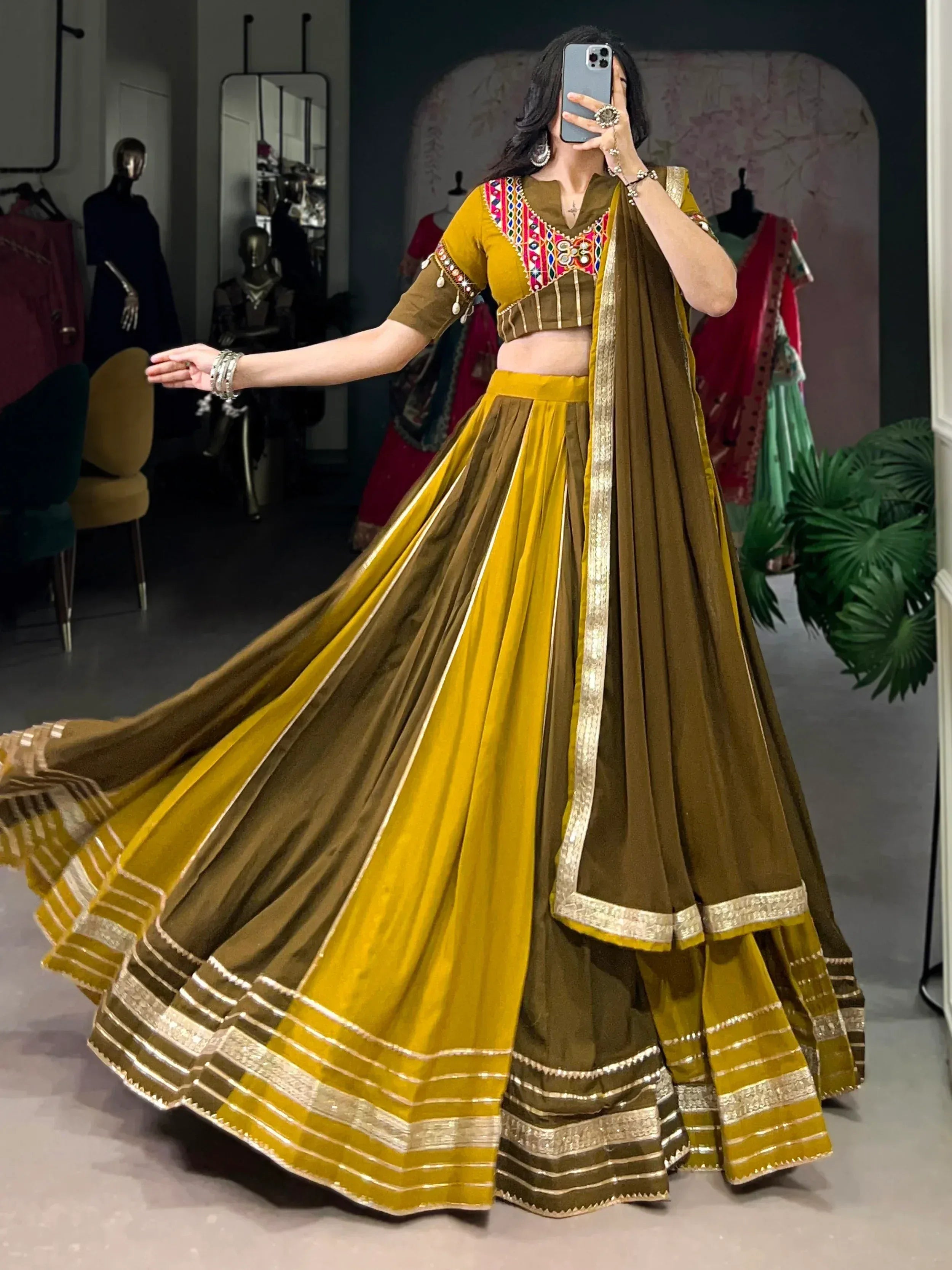 Mustard and olive green designer lehenga choli with mirror work and gold trim, perfect for Indian ethnic wear