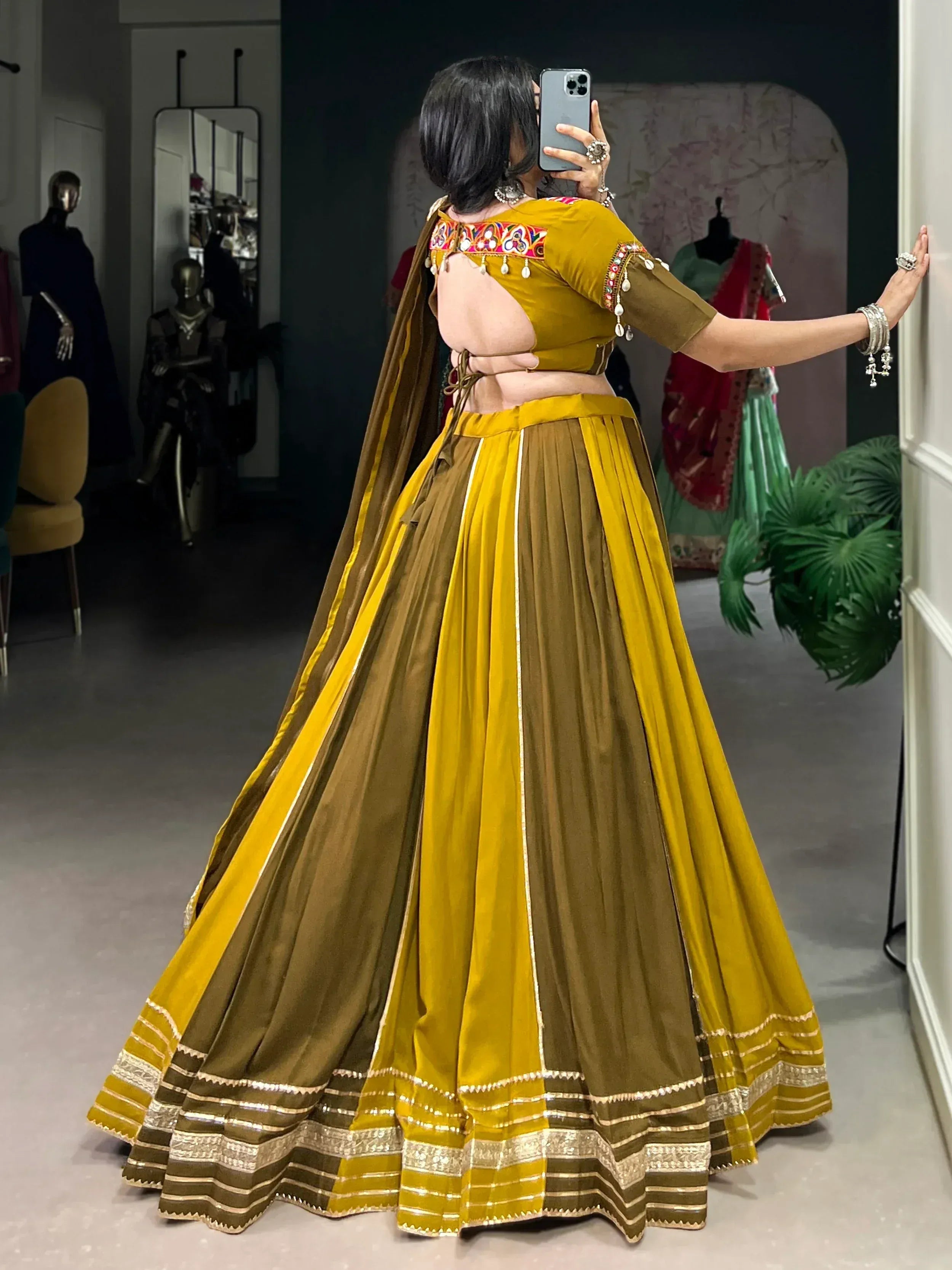 Mustard and olive green designer lehenga choli with embroidered back and mirror work, perfect for Indian ethnic wear