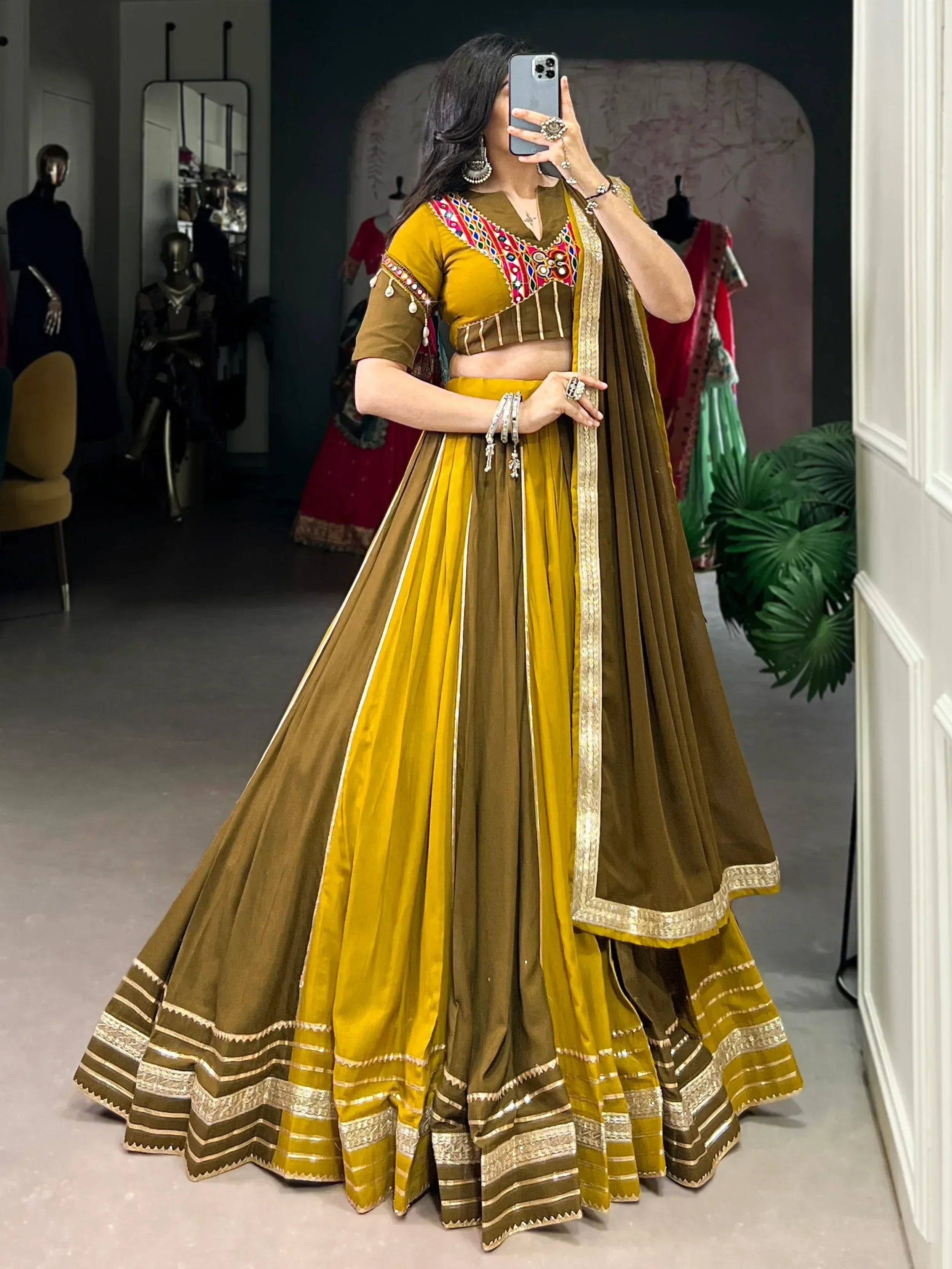 Mustard and olive green designer lehenga choli with mirror work and gold border, perfect for Indian ethnic wear.