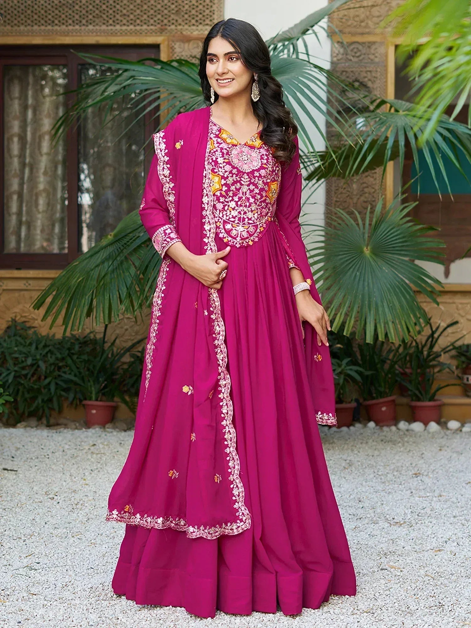 Magenta embroidered anarkali suit with floral detailing, perfect for Indian ethnic wear occasions