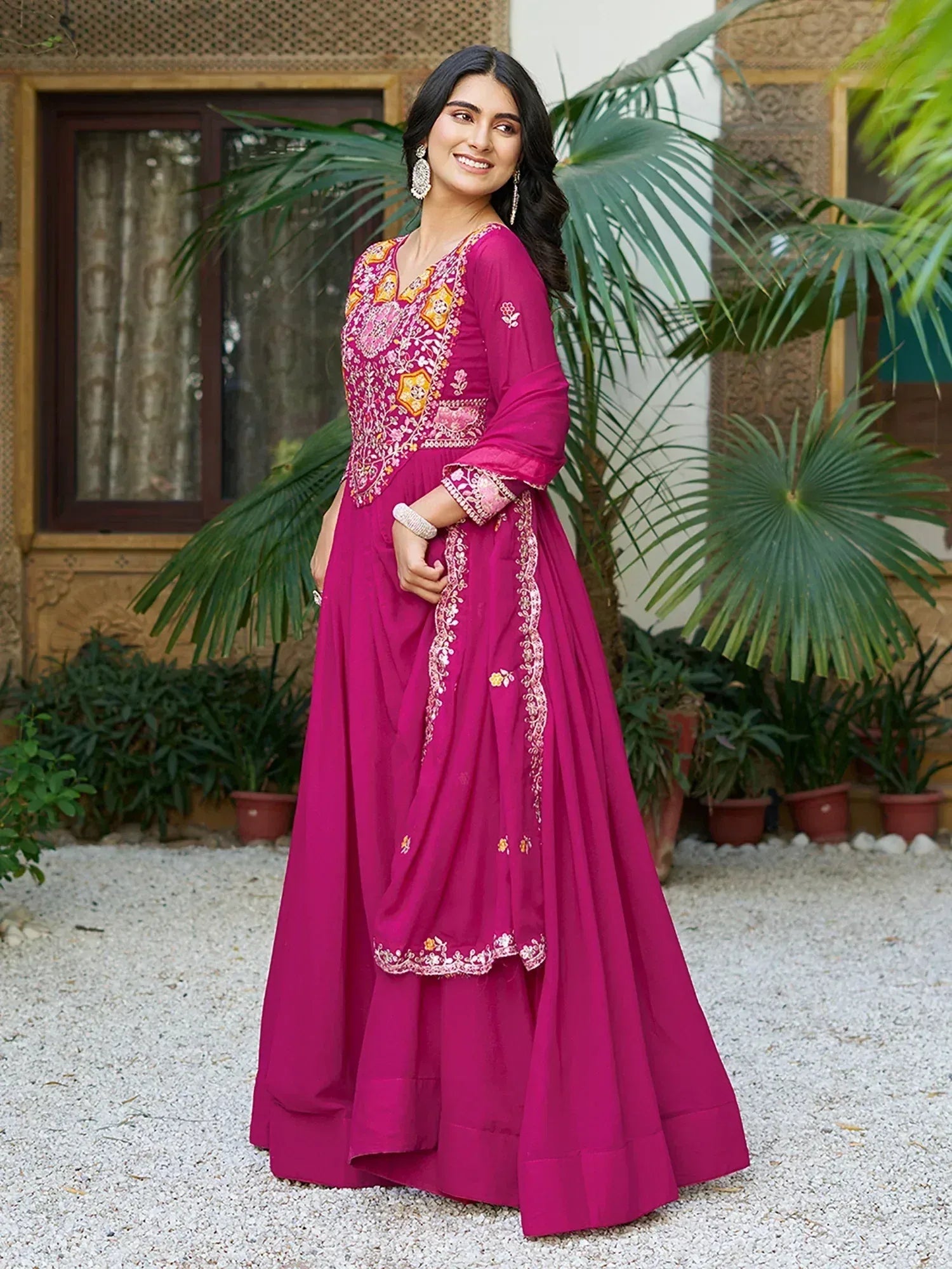 Magenta embroidered anarkali suit with floral detailing, perfect for Indian ethnic occasions