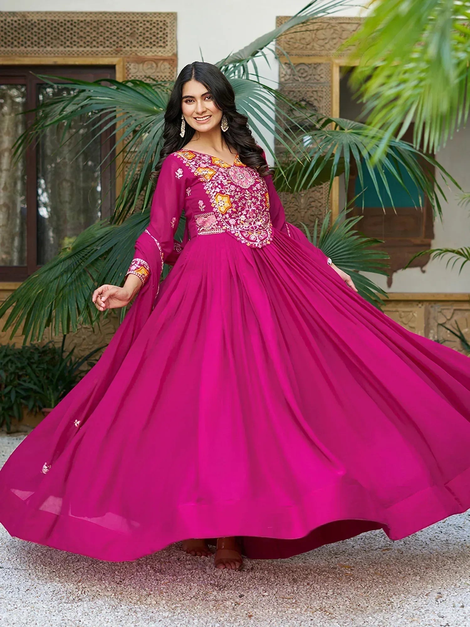 Fuchsia ethnic gown with floral embroidery, perfect for Indian occasions and festive wear