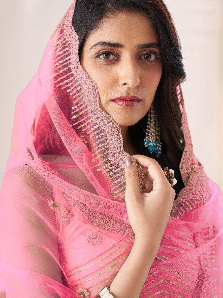 Remarkable Coral Pink Sequins Work Net Wedding Wear Lehenga Choli
