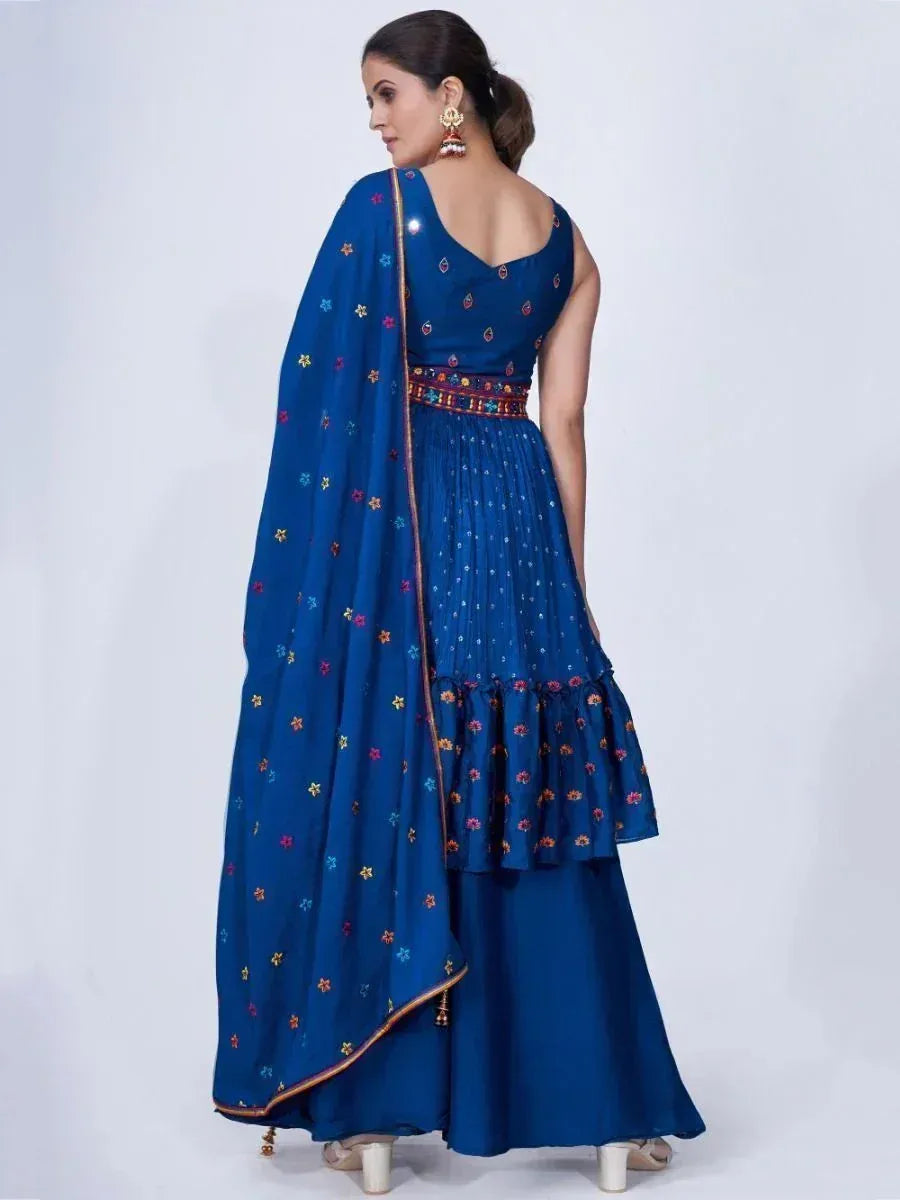 Woman in blue embroidered lehenga choli with dupatta, traditional Indian ethnic wear