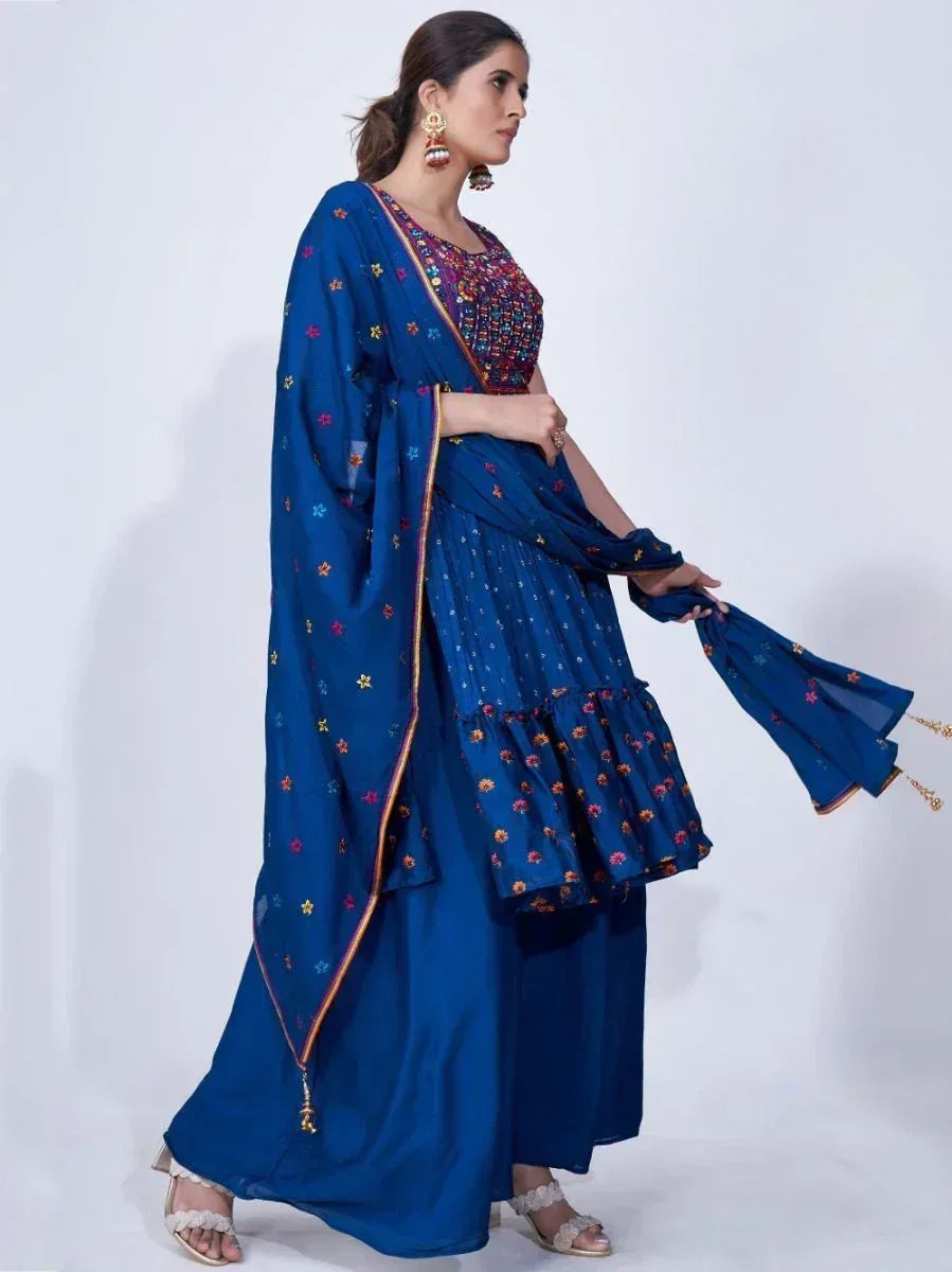 Woman wearing blue embroidered ethnic gown with dupatta, traditional Indian outfit