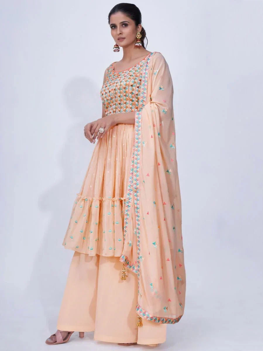 Woman wearing peach embroidered palazzo suit with dupatta, Indian ethnic wear