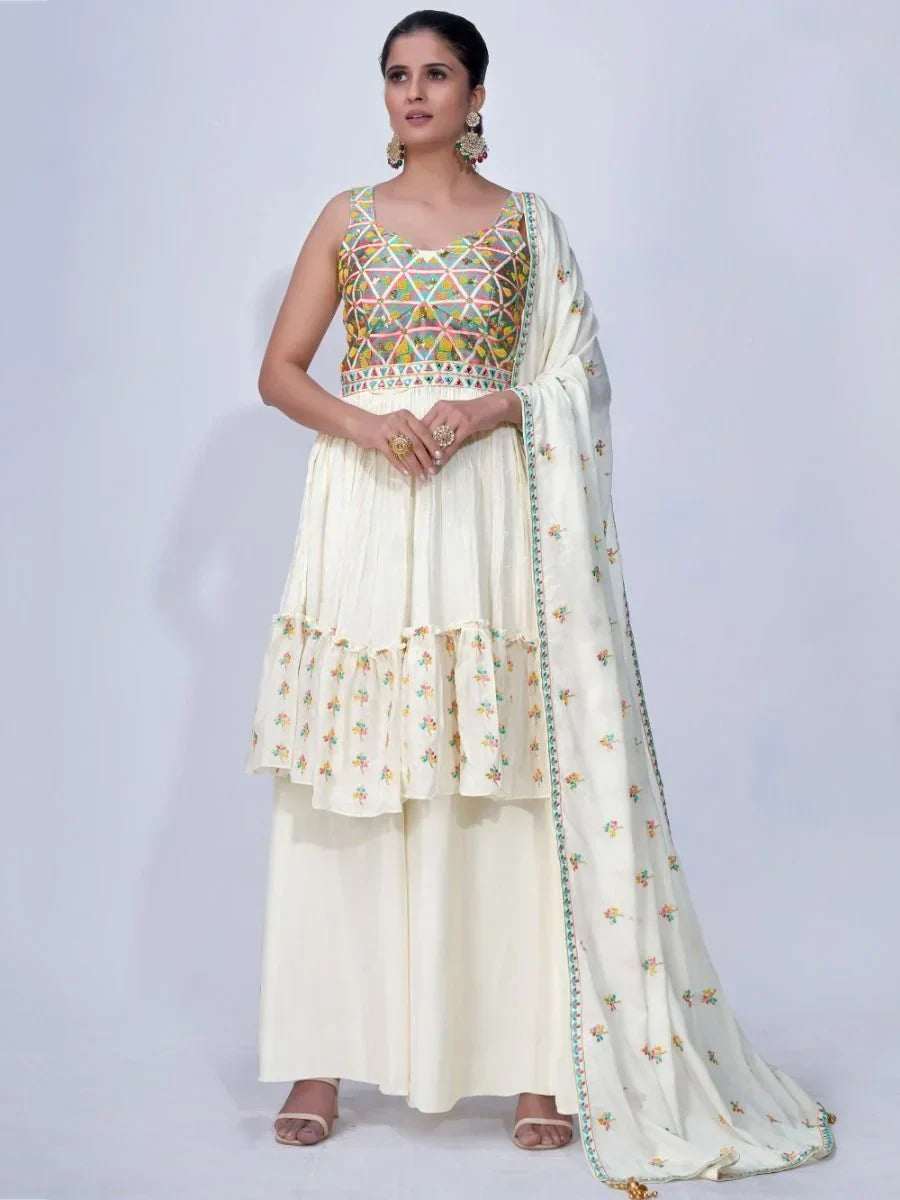 Woman in cream embroidered palazzo suit with multicolor geometric bodice and dupatta