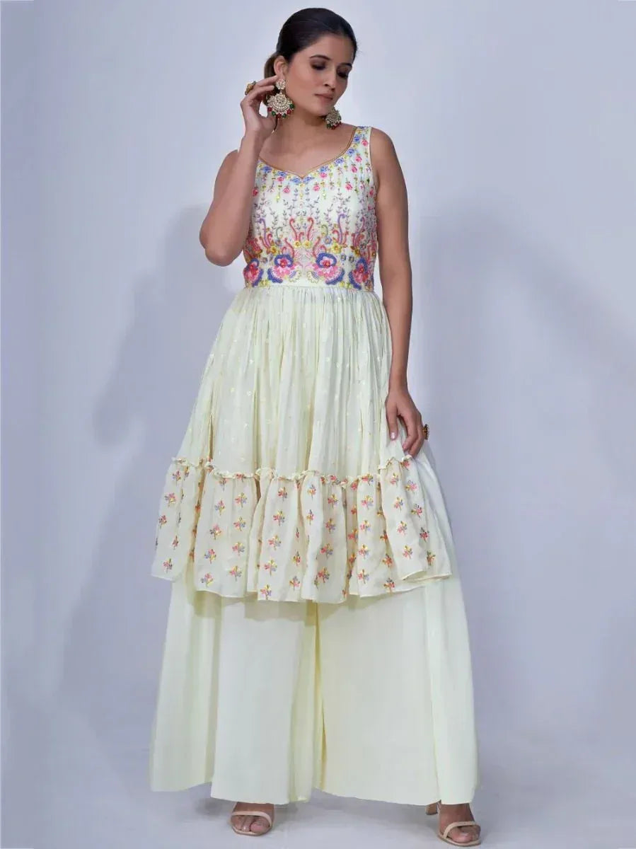 Pastel yellow embroidered ethnic gown with flared skirt and palazzo pants, perfect for festive occasions