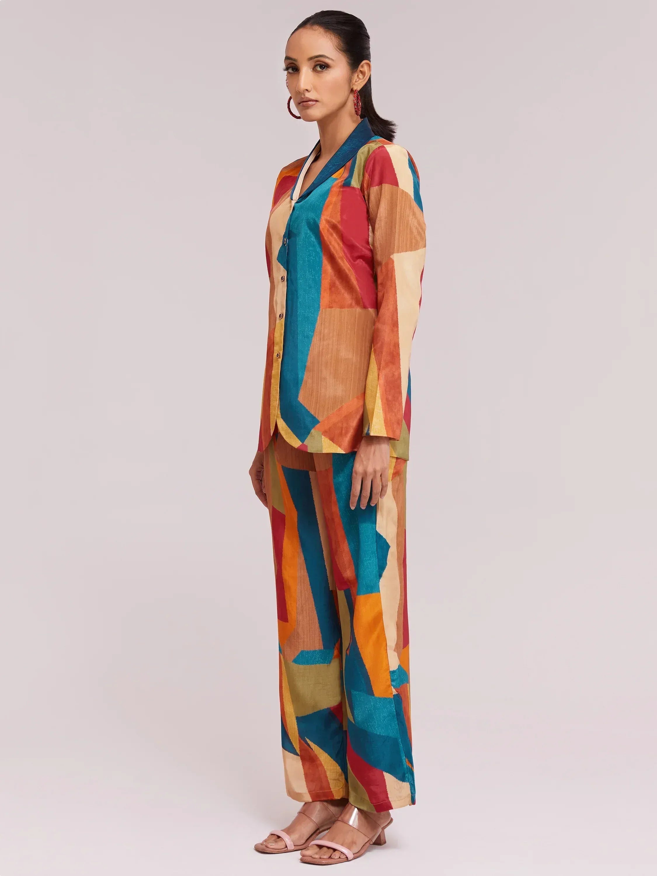 Colorful abstract print ethnic palazzo suit with button-front top, perfect for Indian festive occasions.