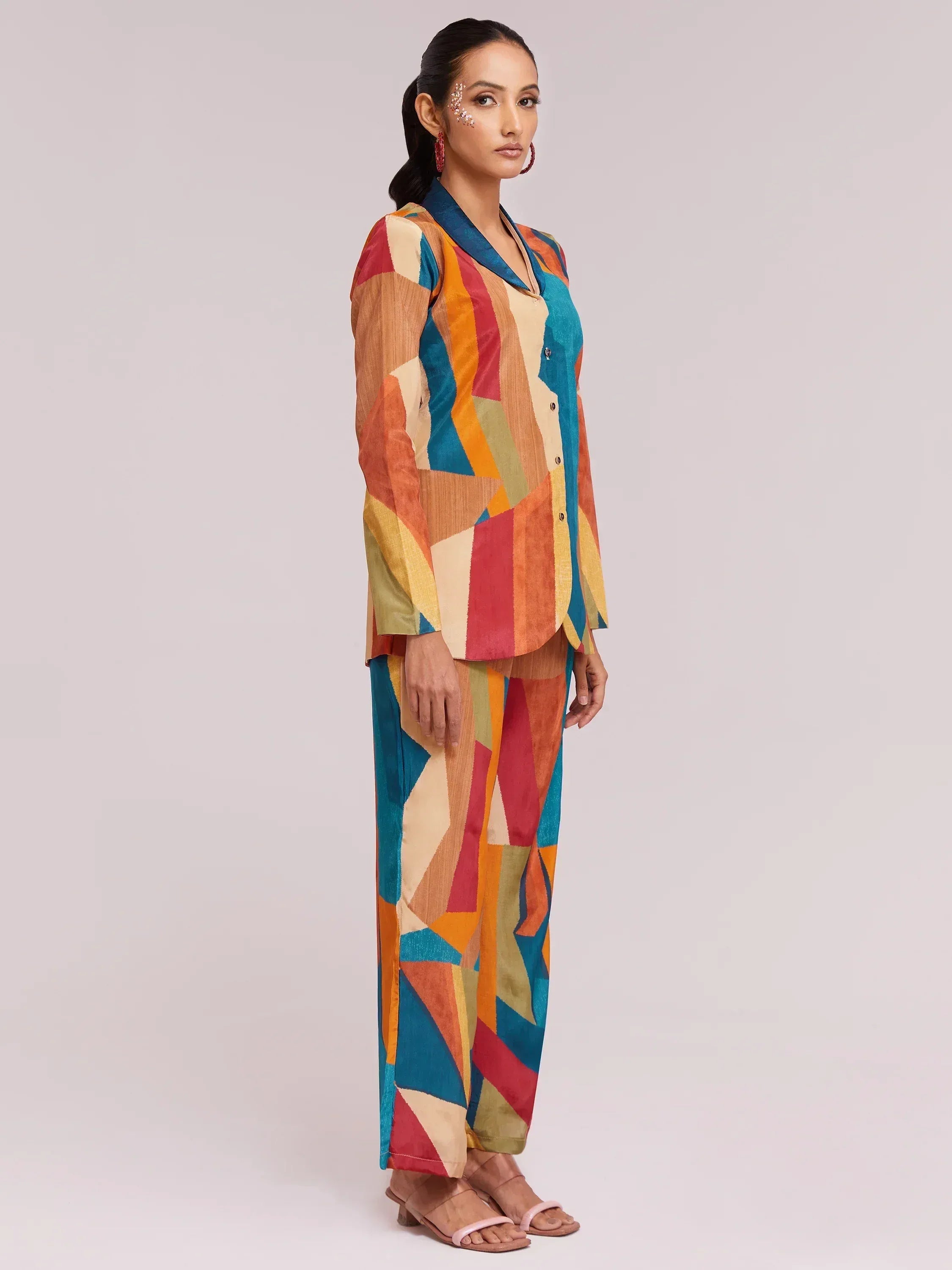 Colorful geometric print ethnic palazzo suit with button-front top, perfect for Indian festive occasions.