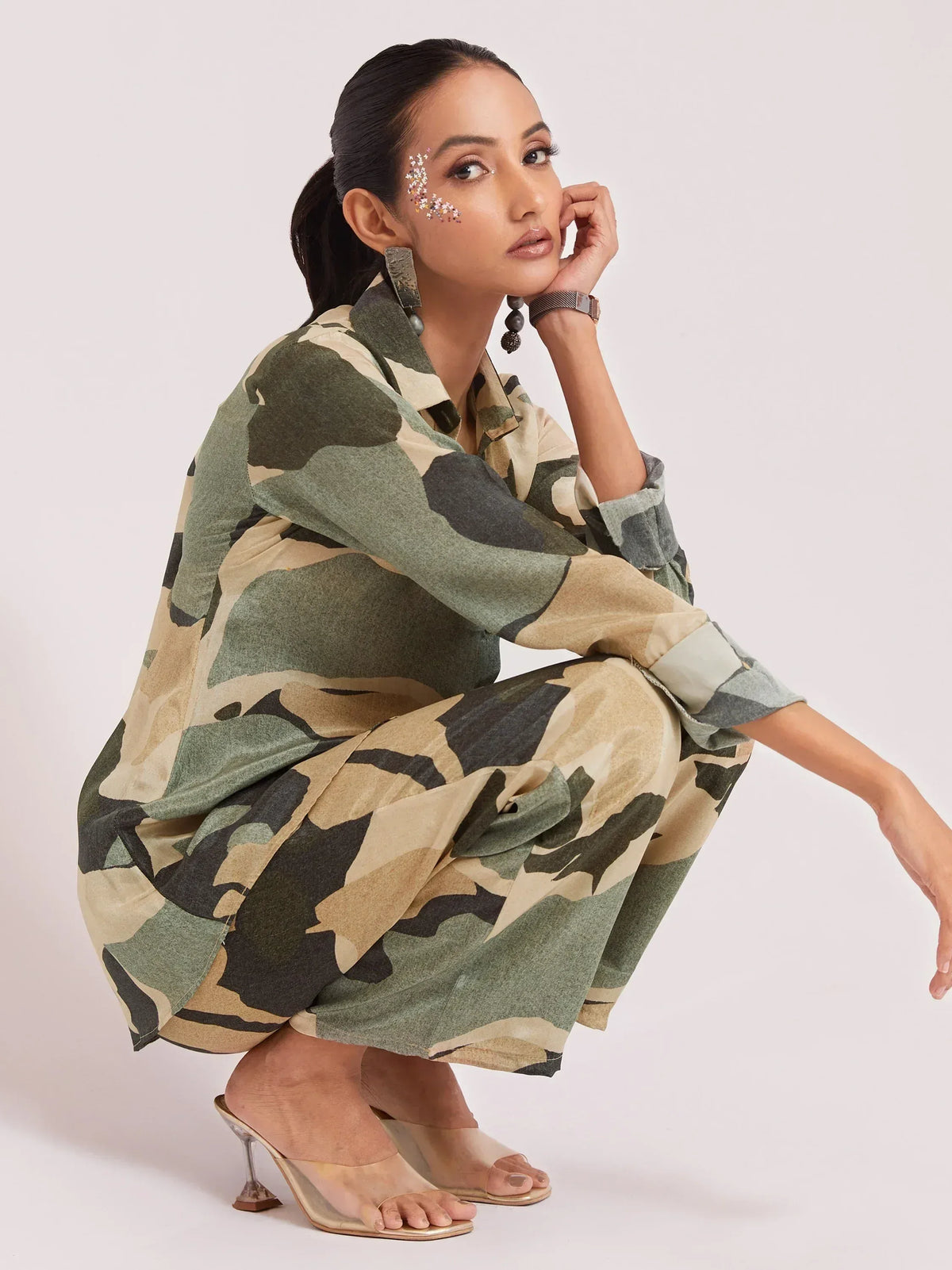 Woman in camouflage print ethnic kurta set with statement earrings and clear heels