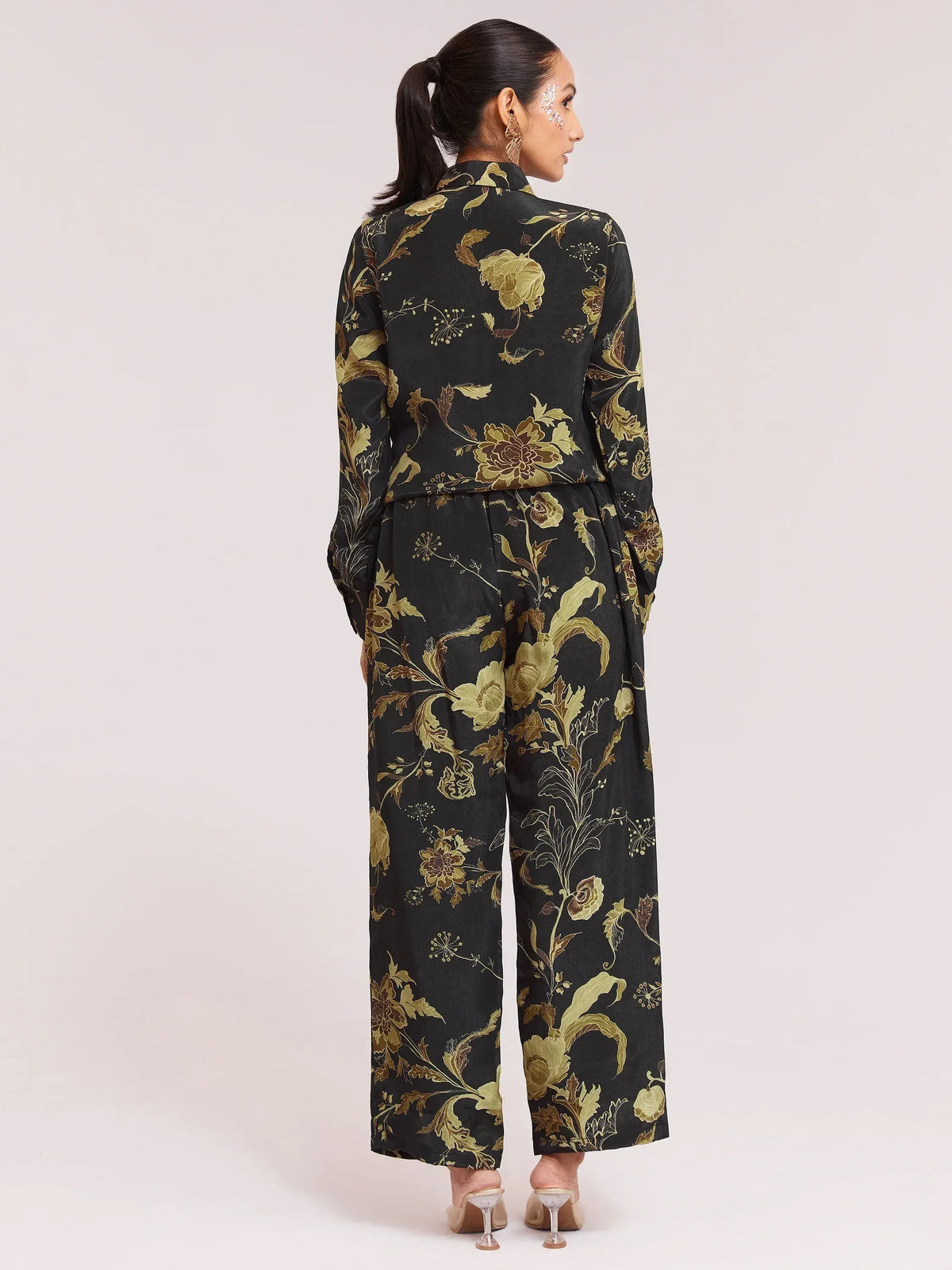 Black and gold floral print ethnic jumpsuit with wide legs, perfect for festive occasions