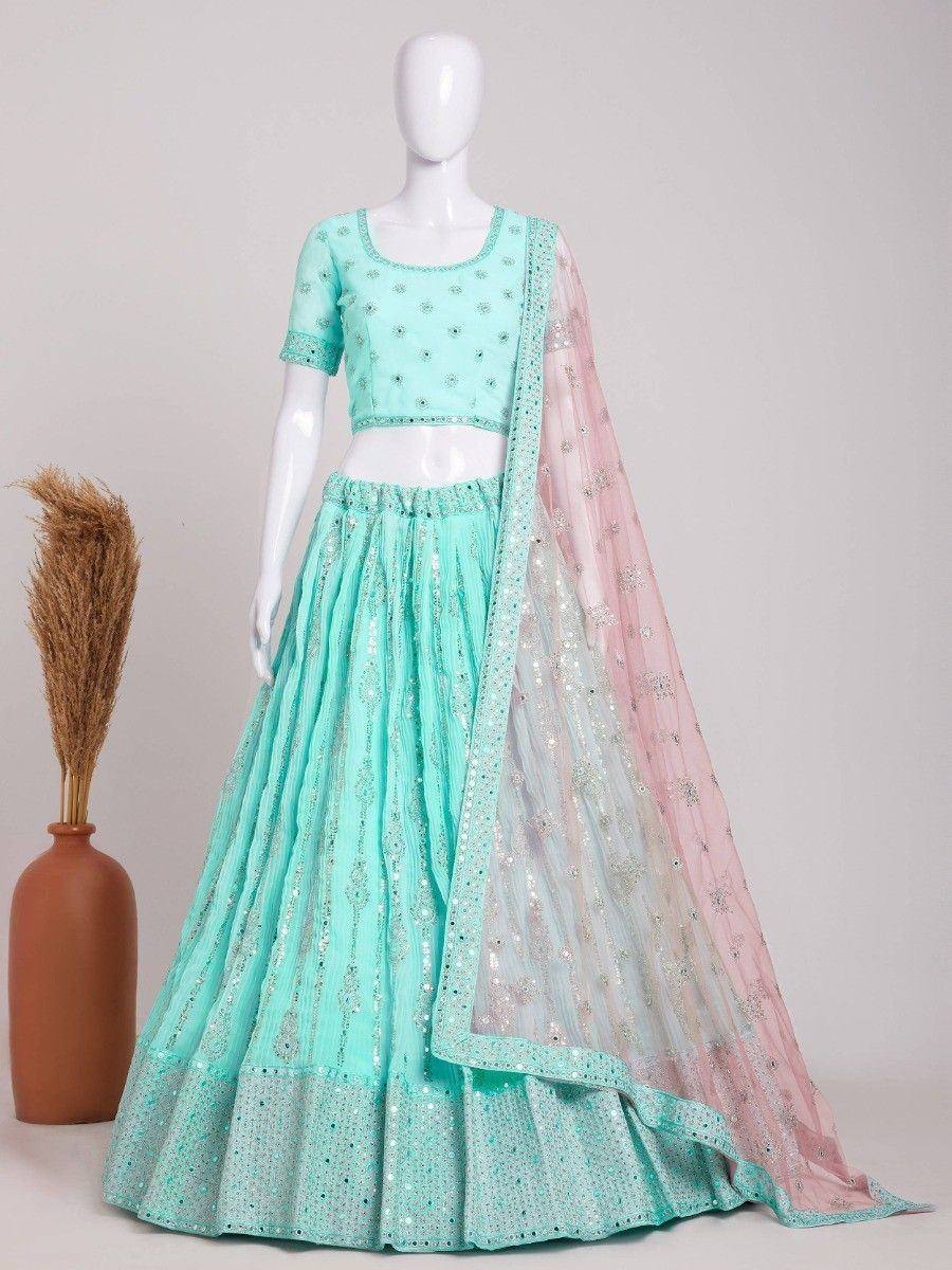 Mint green embroidered lehenga choli with pink dupatta, perfect for Indian ethnic occasions