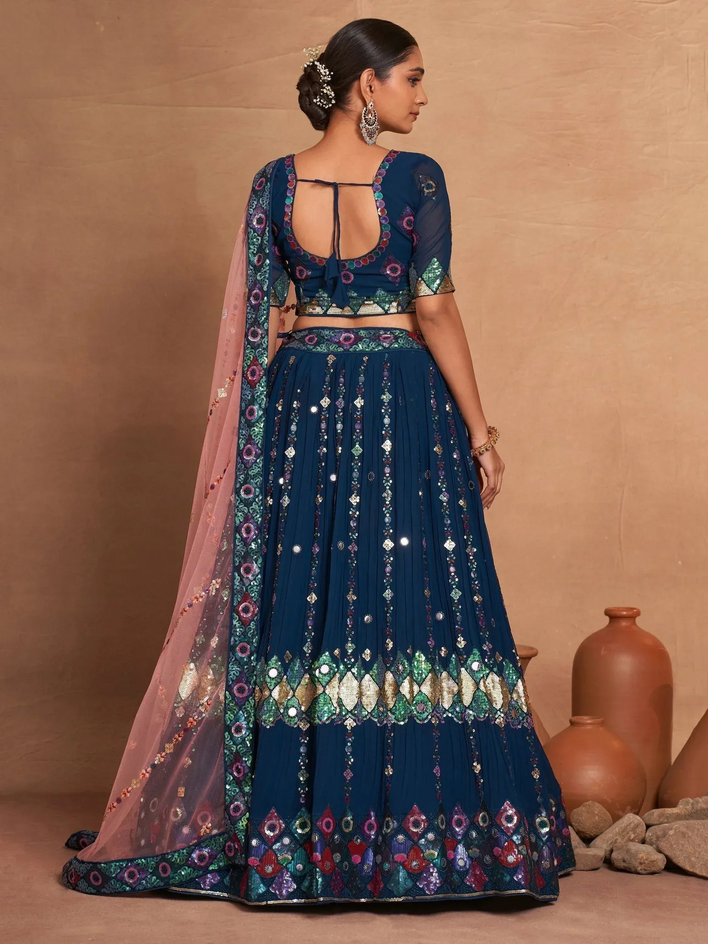 Blue designer lehenga choli with mirror work and pink dupatta, perfect for Indian ethnic wear.