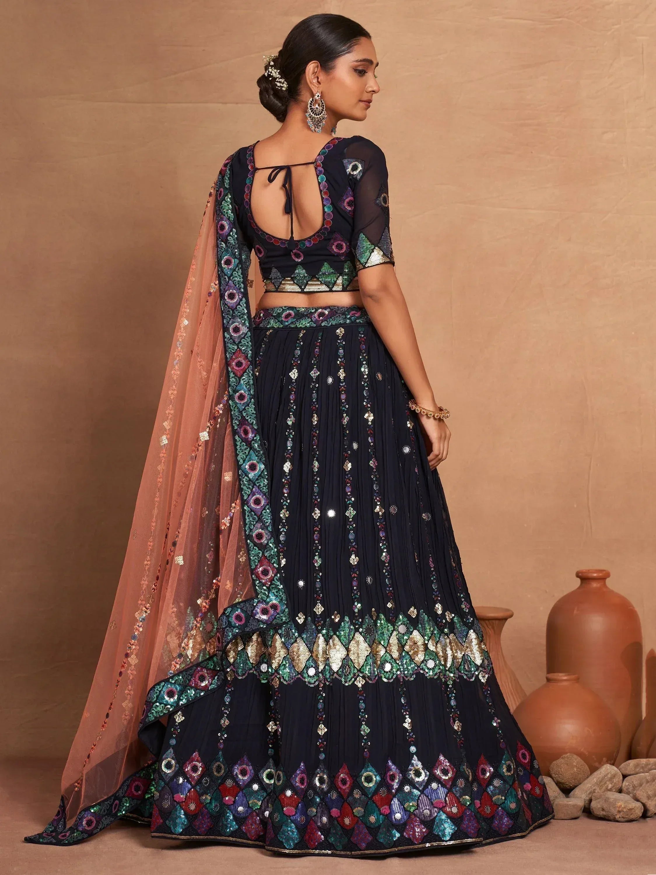 Elegant navy blue lehenga choli with colorful mirror work and sheer dupatta for Indian ethnic wear