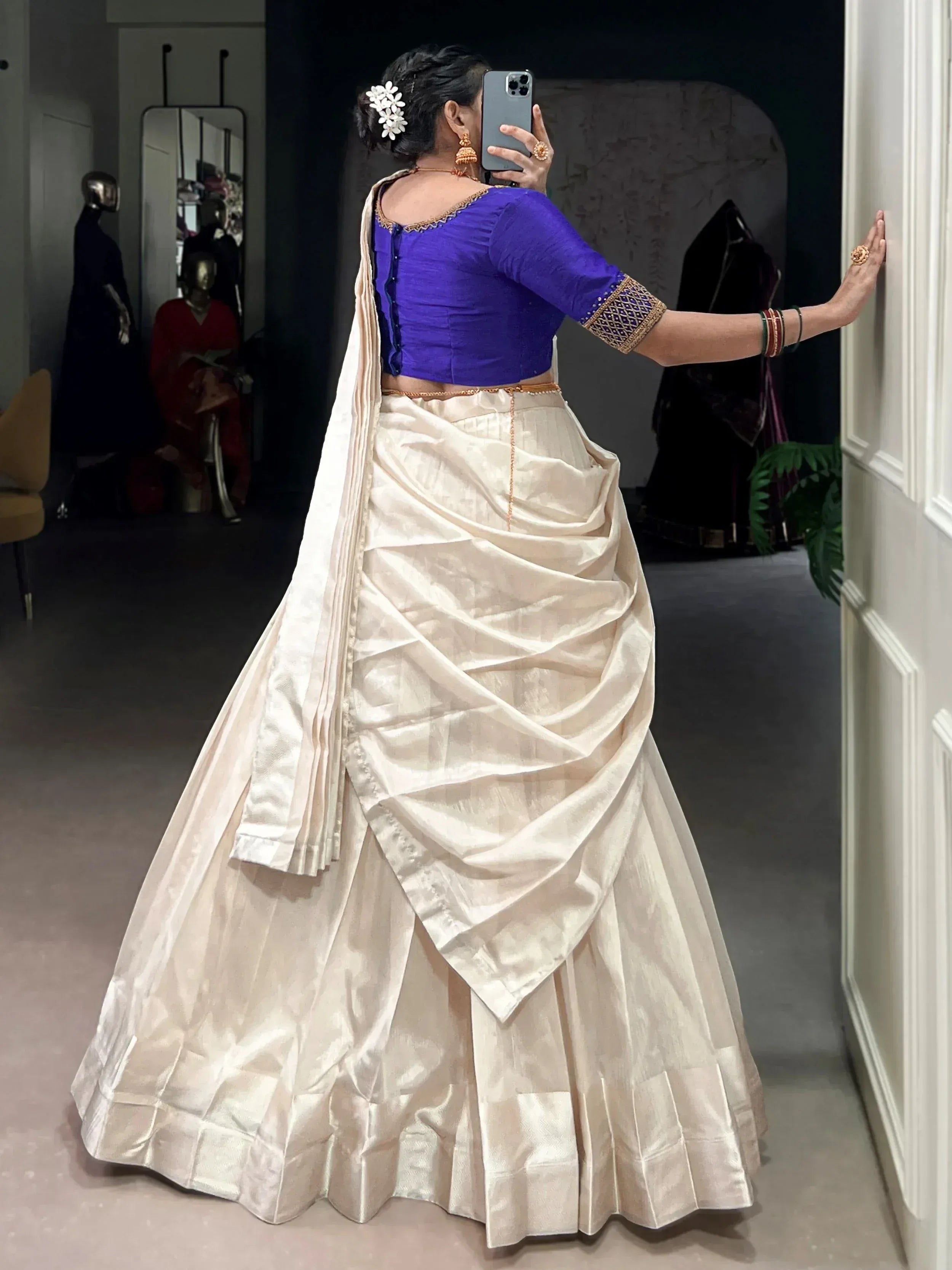 Woman in cream lehenga with purple blouse, ethnic Indian wear, designer outfit, mirror selfie