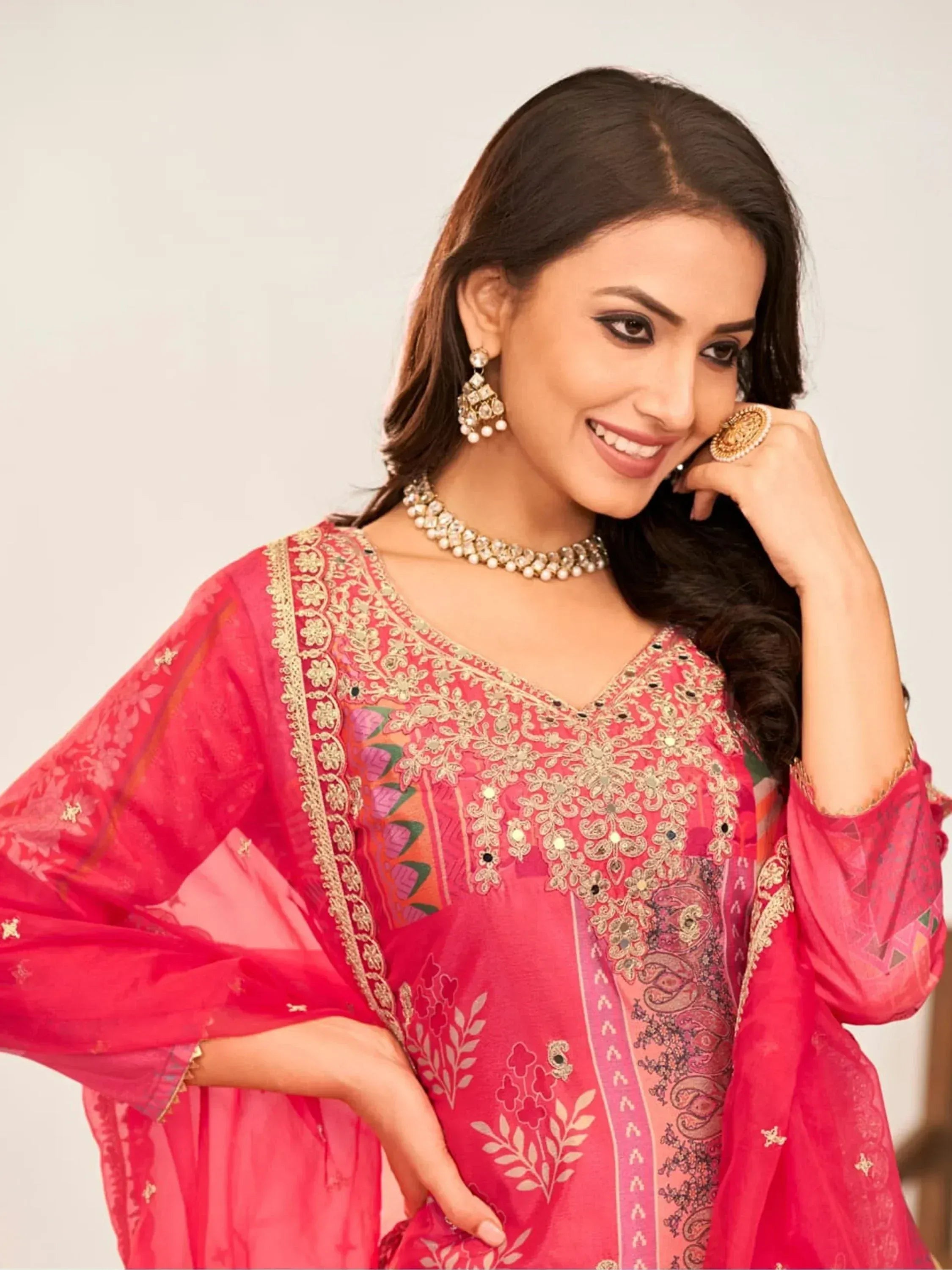 Pink embroidered ethnic kurti with gold detailing, perfect for festive occasions and traditional wear.