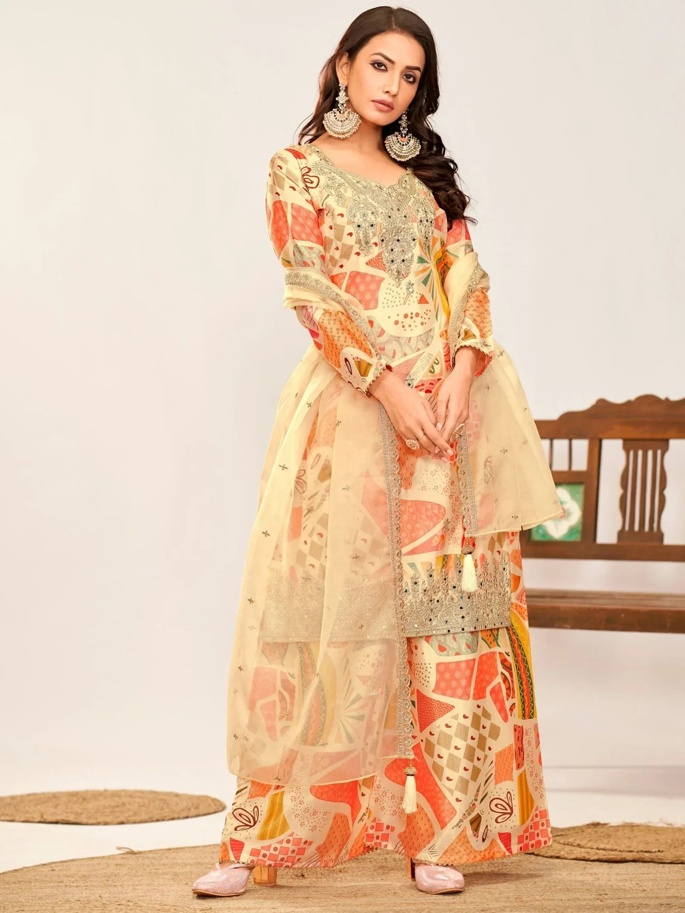 Elegant Indian ethnic wear with geometric print, embellished neckline, and sheer overlay for festive occasions.