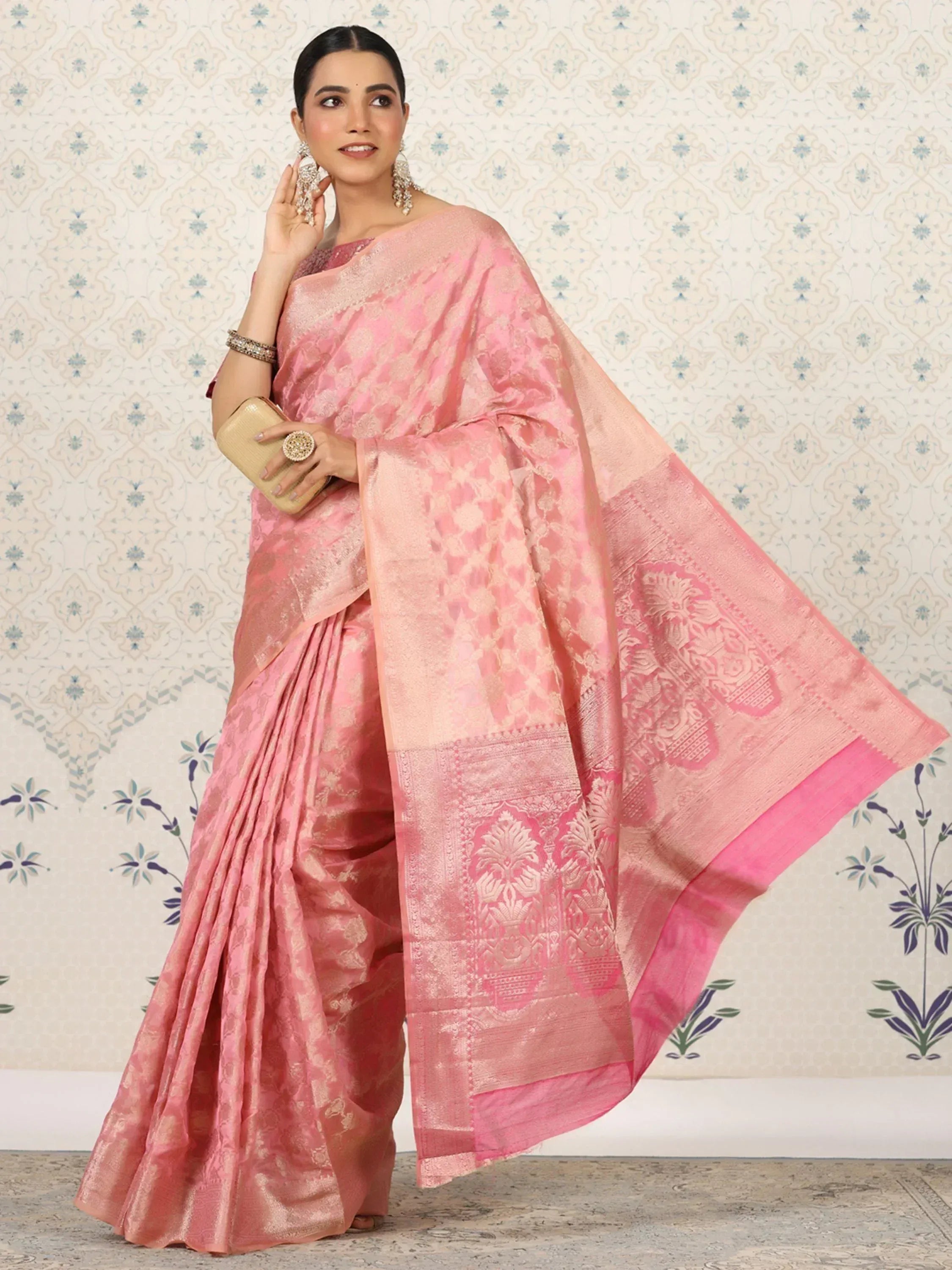Pink designer saree with intricate gold floral patterns, perfect for Indian ethnic wear occasions