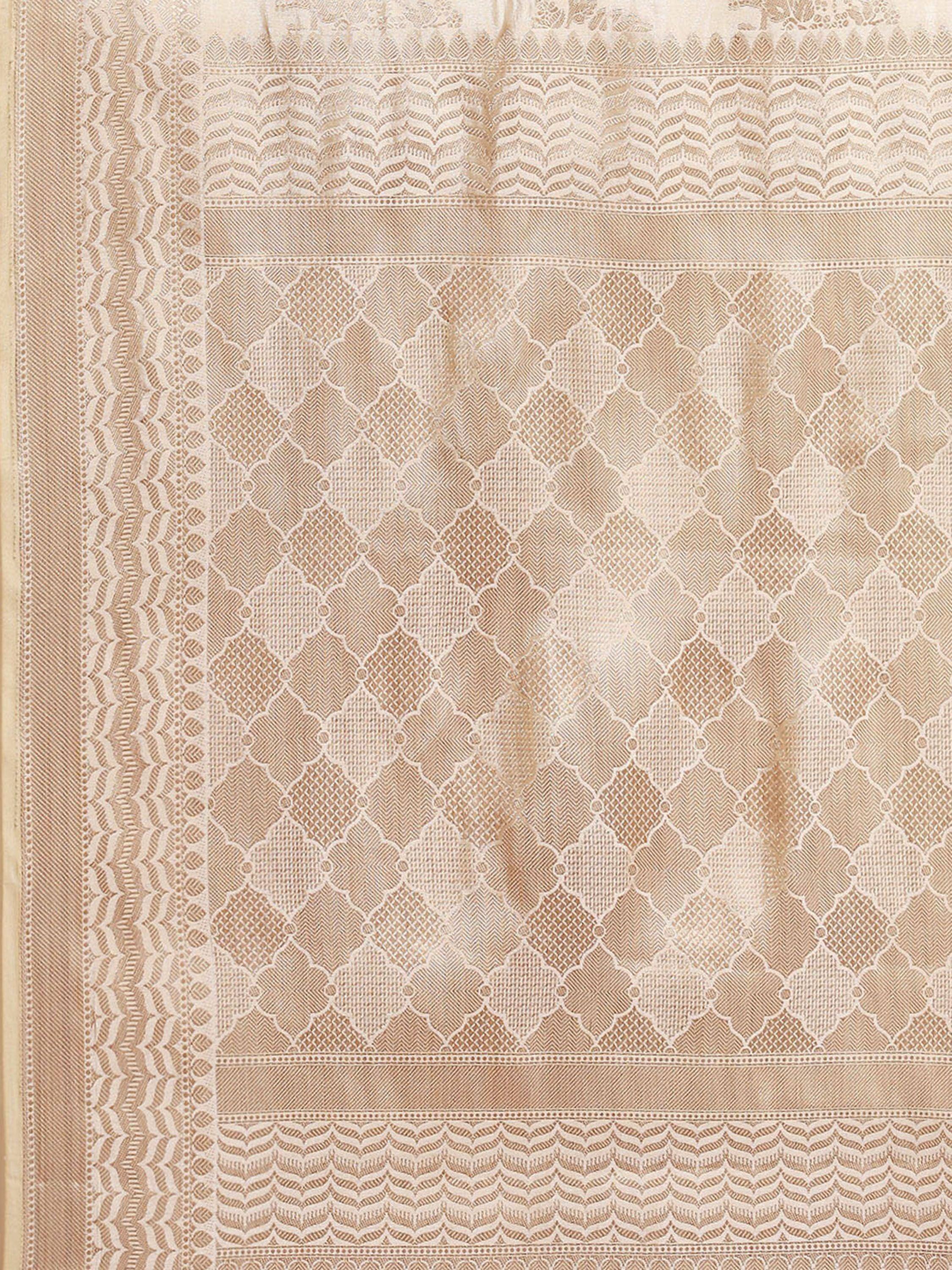 Beige ethnic saree with intricate geometric and scalloped border patterns, ideal for traditional Indian wear.