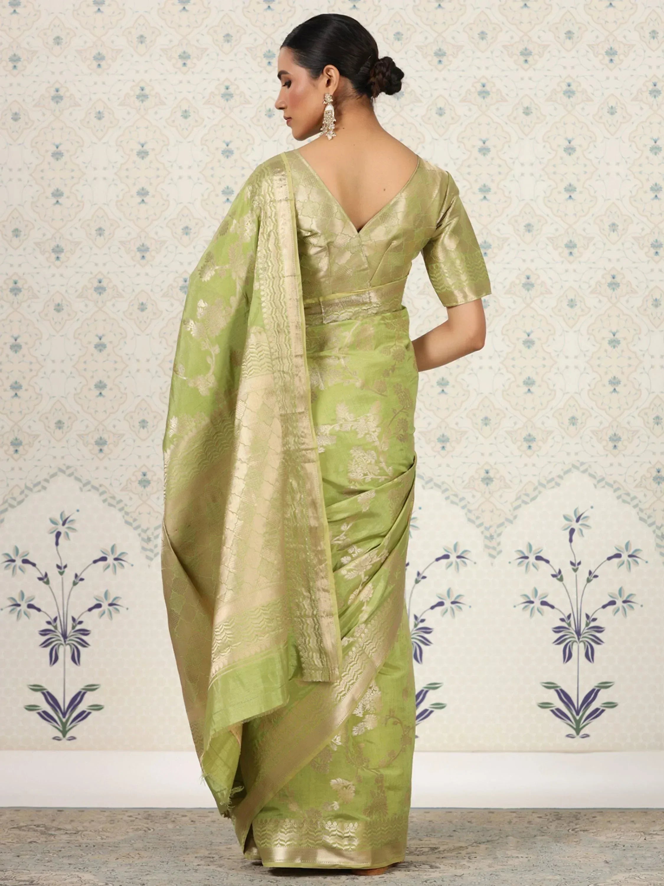 Light green floral jacquard saree with gold border, back view