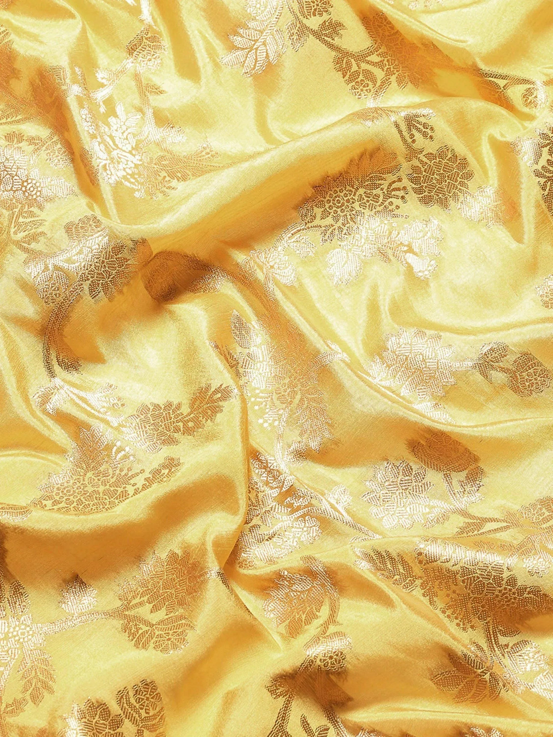 Golden floral brocade fabric for ethnic wear, perfect for designer lehenga choli or sarees.