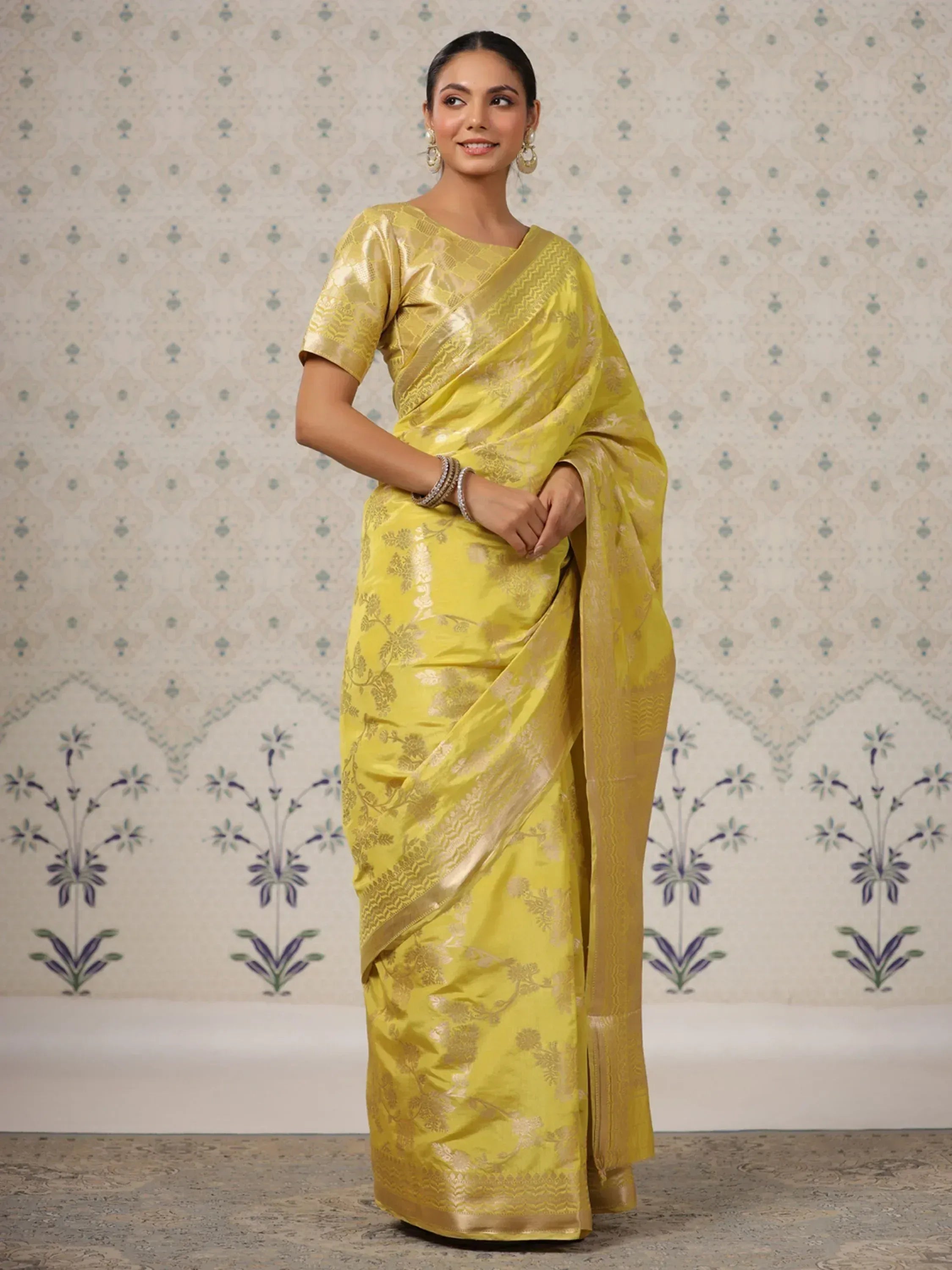 Yellow floral saree with gold embroidery, perfect for ethnic occasions