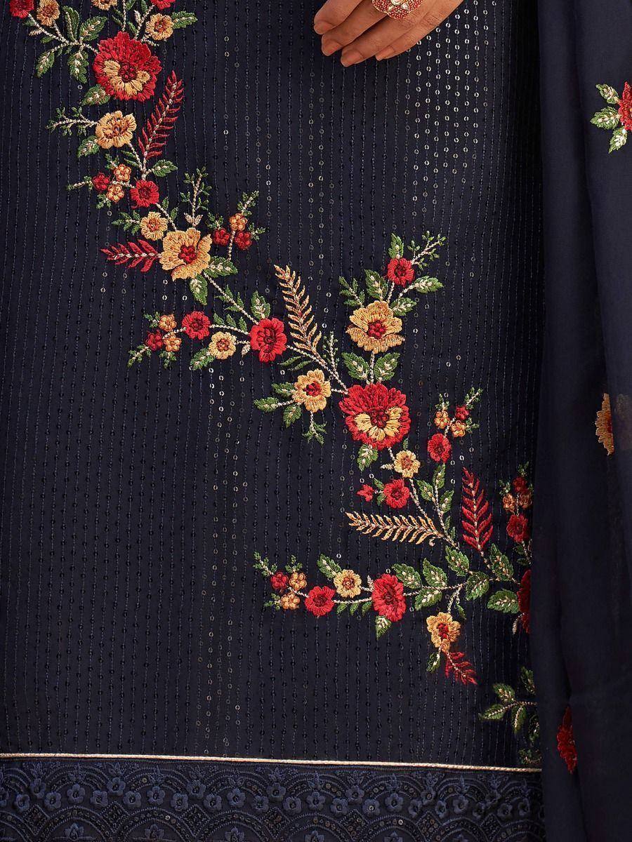 Navy blue ethnic gown with vibrant floral embroidery and sequin detailing, perfect for festive occasions.