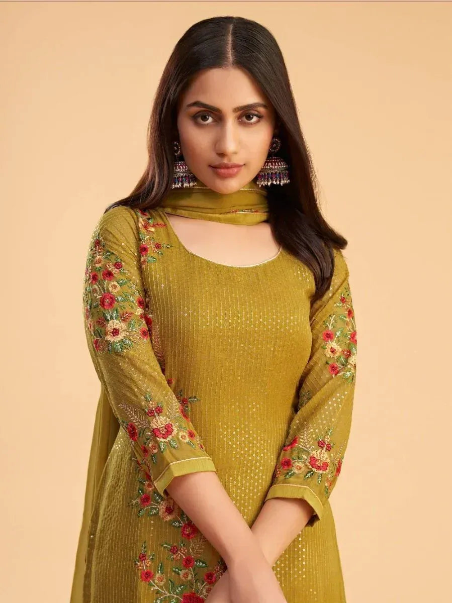 Woman wearing yellow embroidered salwar kameez with floral sleeves and dupatta