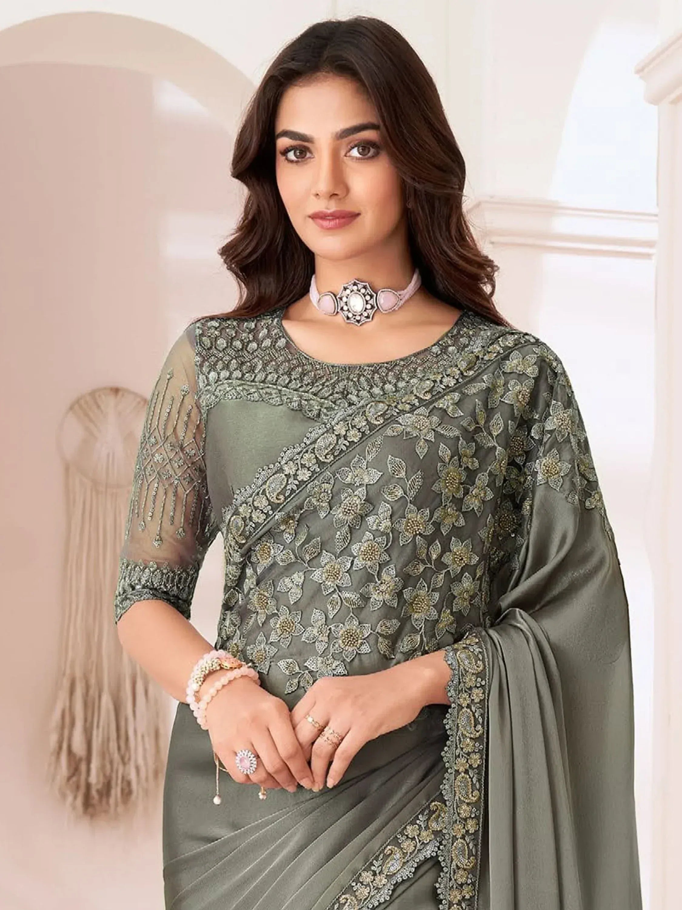 Olive green embroidered saree with floral zari work, perfect for Indian ethnic occasions and weddings.